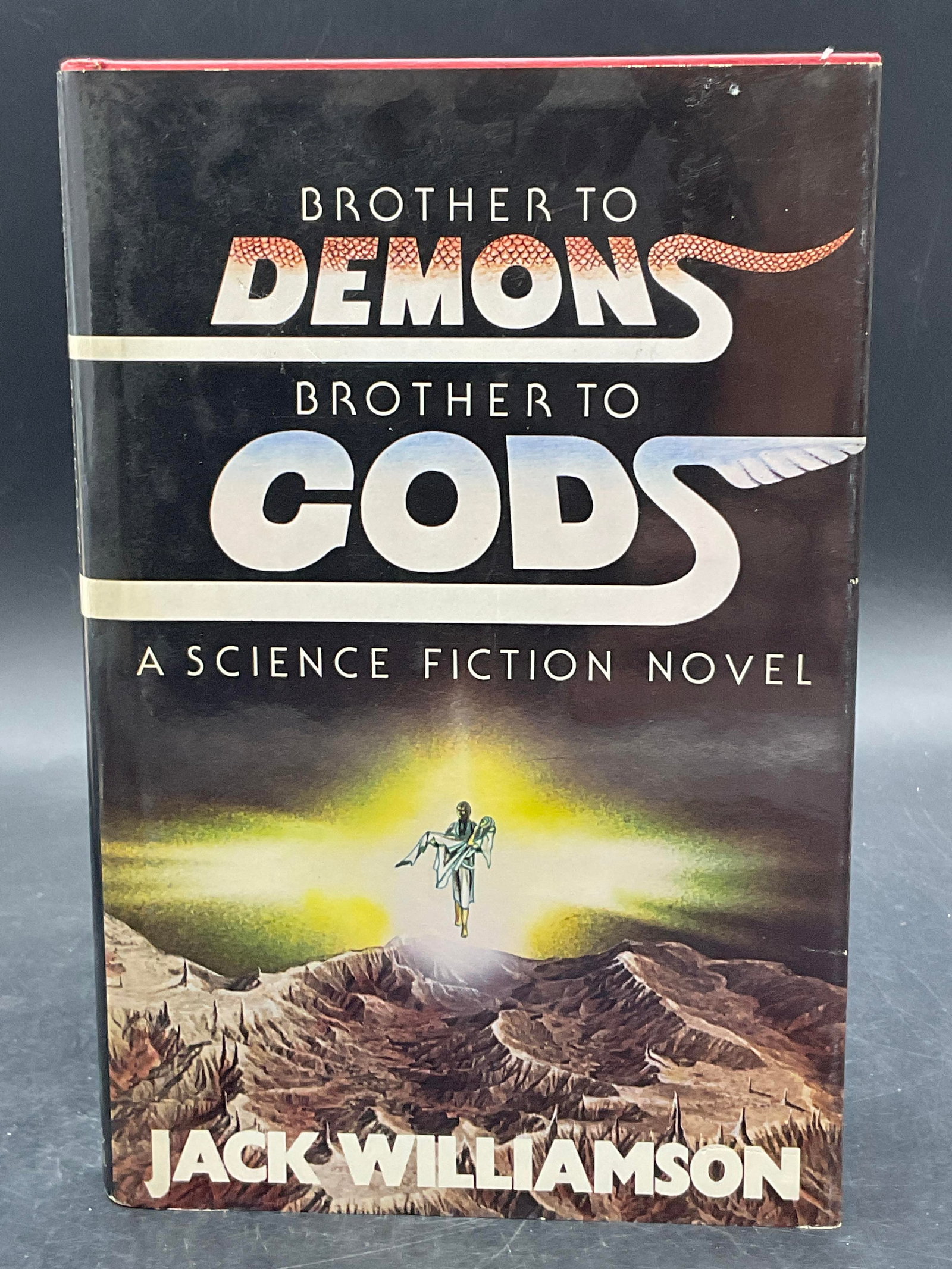 1979 Brother to Demons Brother to Gods 1st Prnting: Brother to Demons Brother to Gods by Jack Williamson. Published by Bobbs-Merrill. Copyright 1976, 1977, 1978, 1979 by Jack Williamson. First Printing. Measures approx. 8.5H x 5.75W in. Discoloration, 