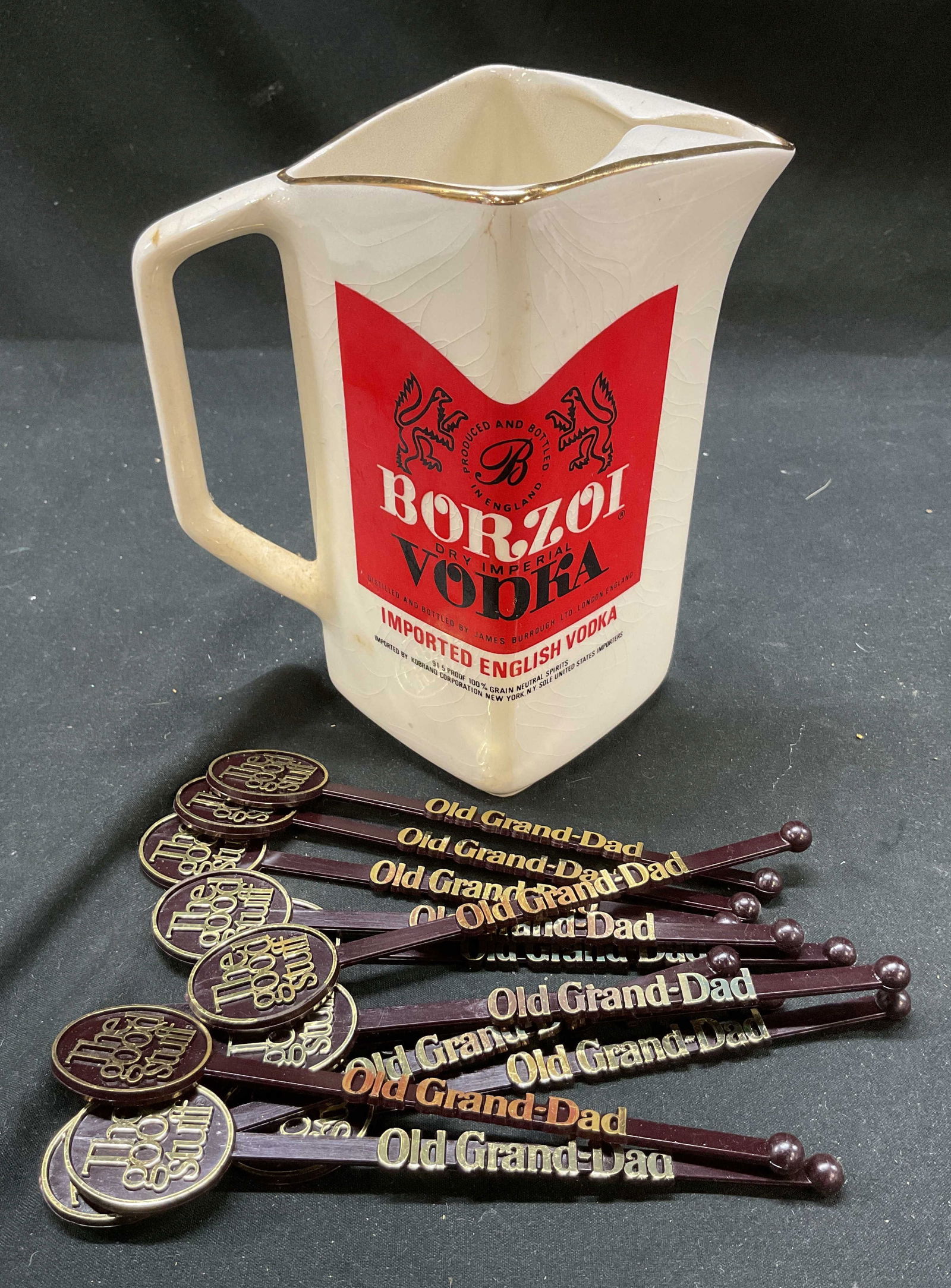 13 Barware, Borzoi Vodka England Pitcher & More: White ceramic square shaped pitcher. Wade Regicor Borzoi Dry Imperial Vodka Pitcher, Made in England, Signed on underside. 12 The good stuff stir sticks reading Old Grand-Dad. Kentucky Straight Bourbo