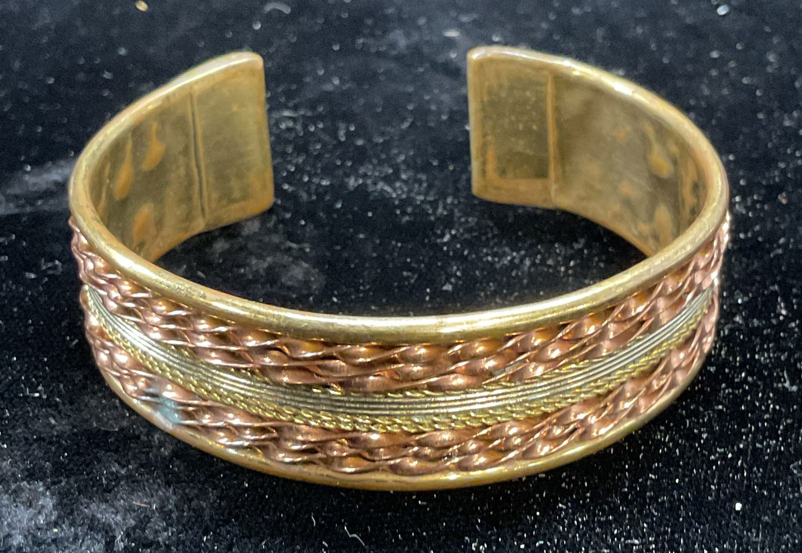Vintage Gold & Copper Tone Cuff Bracelet: Vintage gold and copper toned metal cuff bracelet twisted design. Measures approx 2.25 inches wide. Some wear including scratching observed. Jewelry, estate jewelry, costume jewelry, cocktail jewelry,