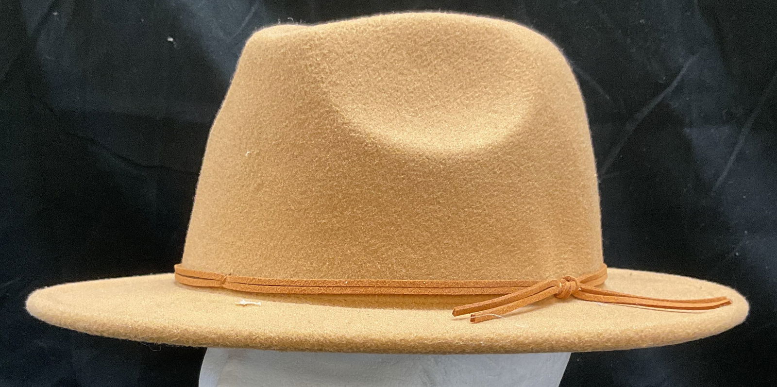 Tan Felt Cord Trim Hat: Tan felt hat with faux suede cord trim. 100% polyester. Measures approx 6 inches wide. Some wear to material consistent with exposure. Hat, felt hat, tan hat, ladies hat, ladies accessories, fashion a