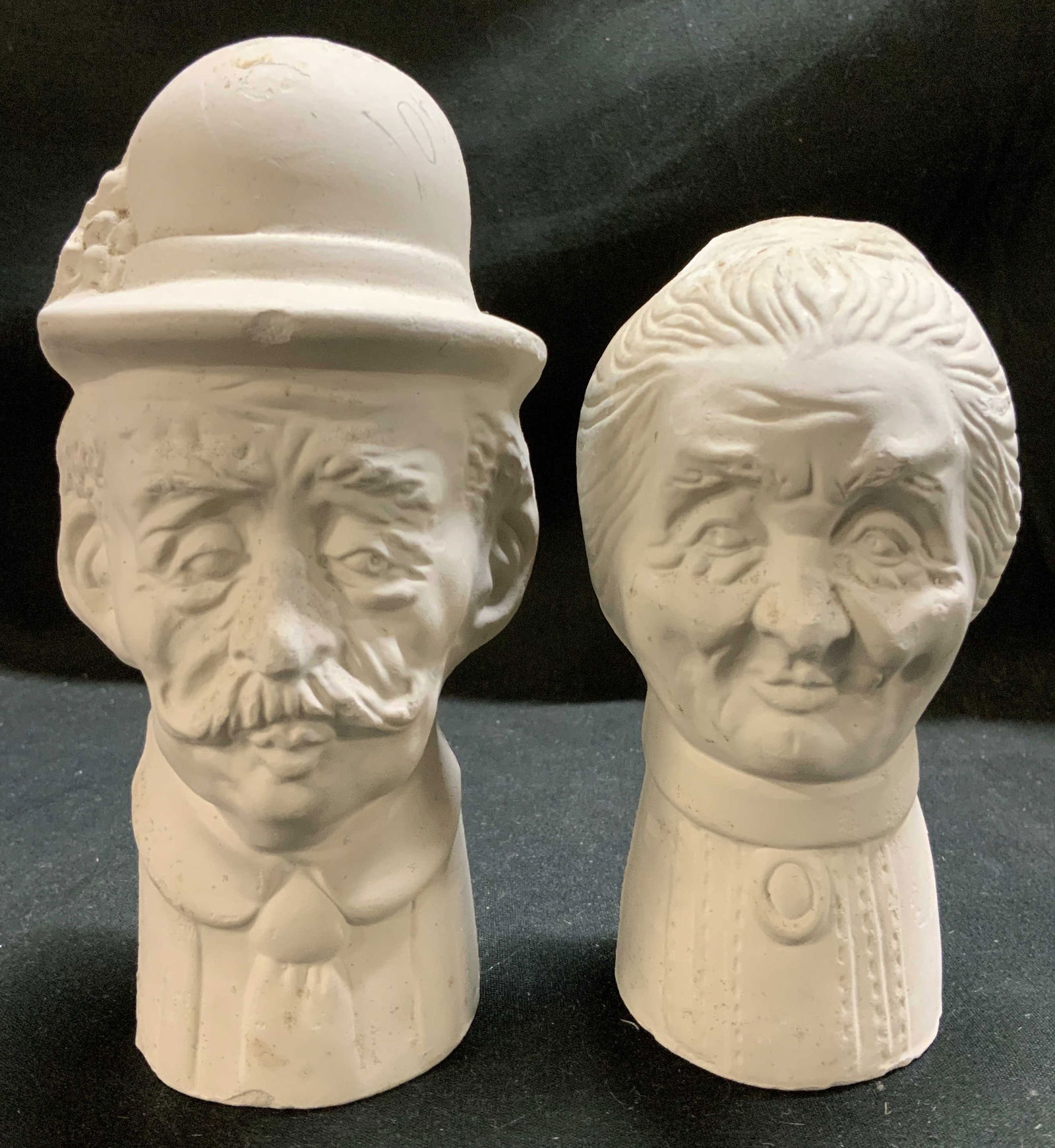 Vntg Elderly Couple Busts HOLLAND MOLD: Appears to be ceramic material. Depicts an elderly man w a bowler hat & mustache. Elderly woman w a bun hairstyle & high-collared blouse. Signed & marked on undersides. Reads, HOLLAND MOLD. Surface we