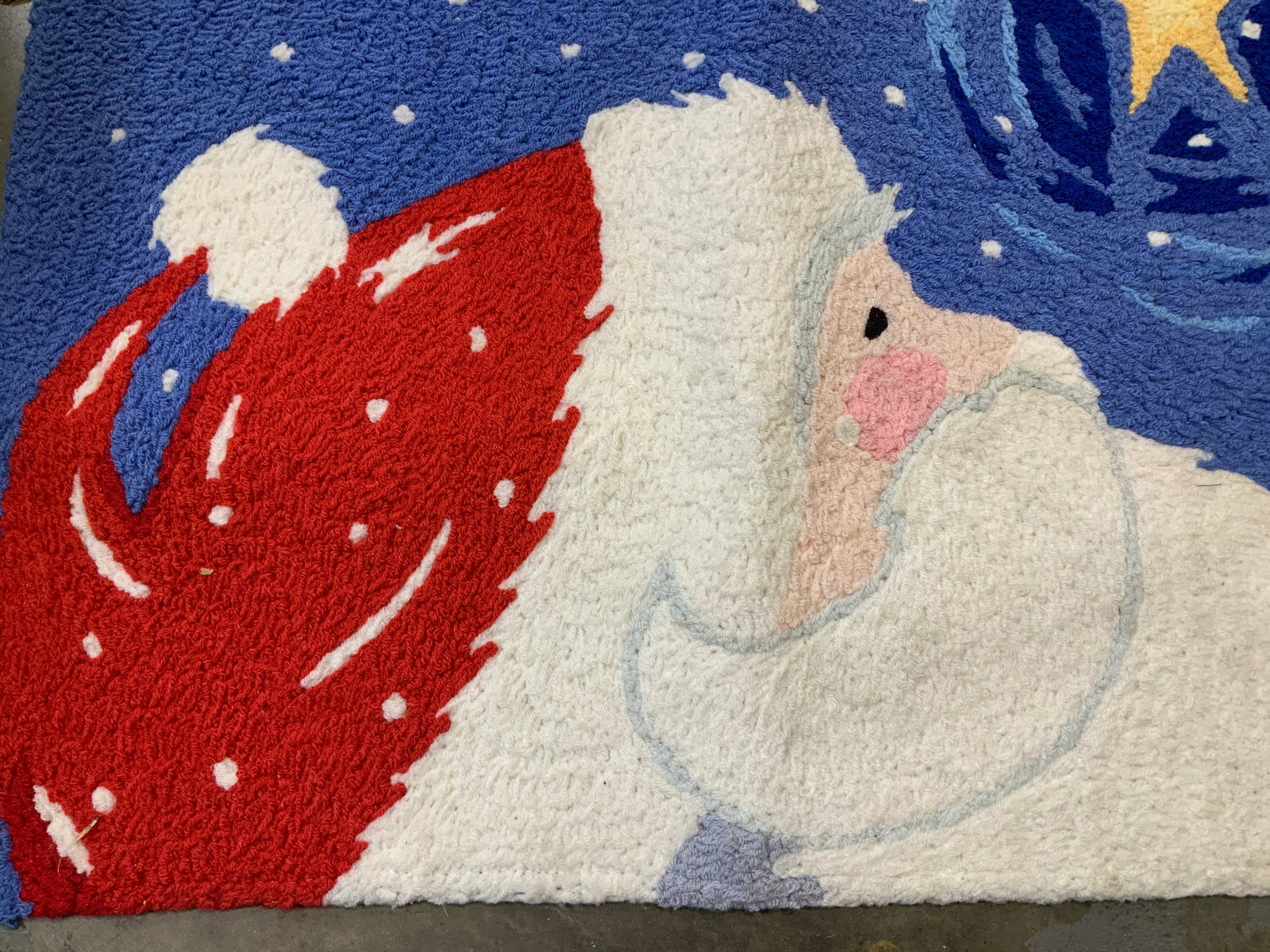 Jellybean Star Gazing Santa Accent Rug: Jellybean Star Gazing Santa accent rug. It features a design of Santa Claus looking up at a bright star in a snowy, night sky. Appears to be polyester material. Signed & marked. Reads, JELLYBEAN. Surf