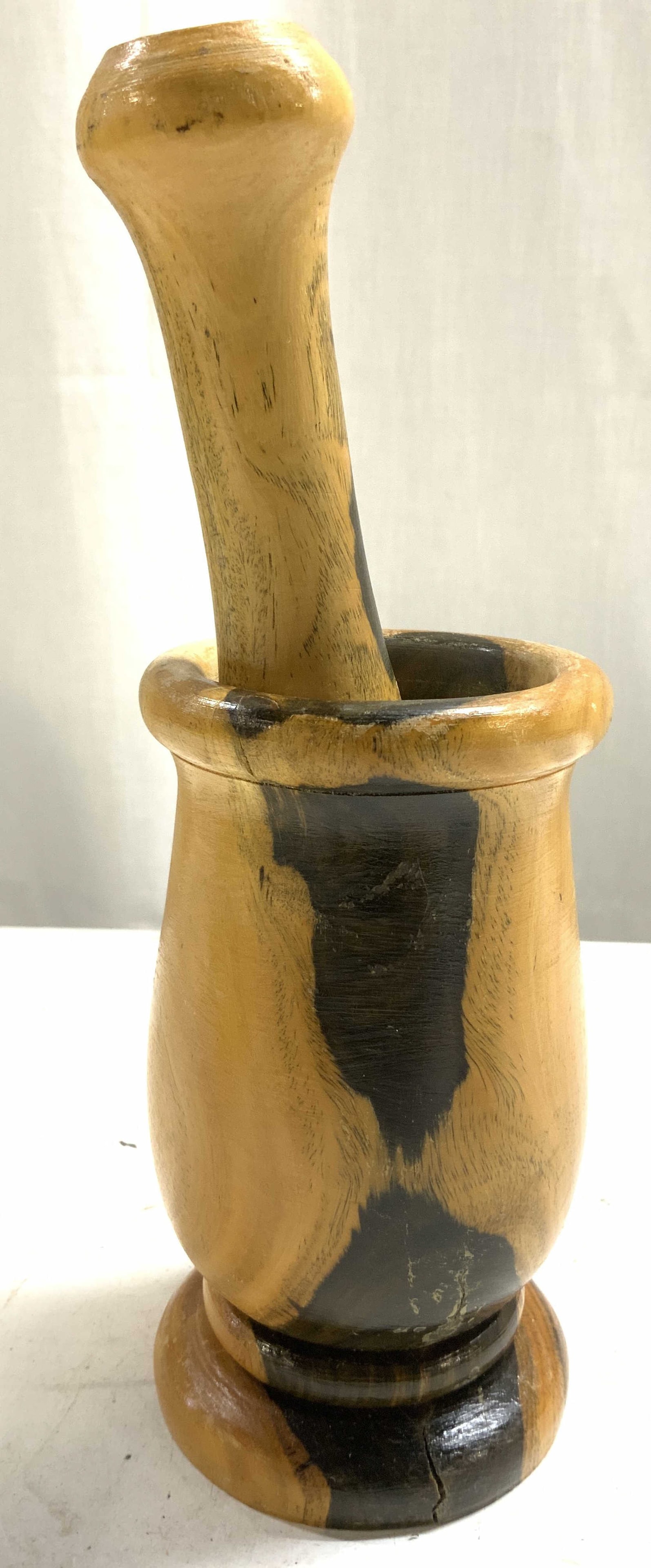 Vntg Hand Turned Wooden Mortar & Pestle: Lot includes 1 mortar and 1 pestle. Each piece is hand turned wood. Pieces are each tan and brown toned. Mortar is footed. Mortar measures approximately 5.5 inches tall 3.25 inches wide. Mortar and pe