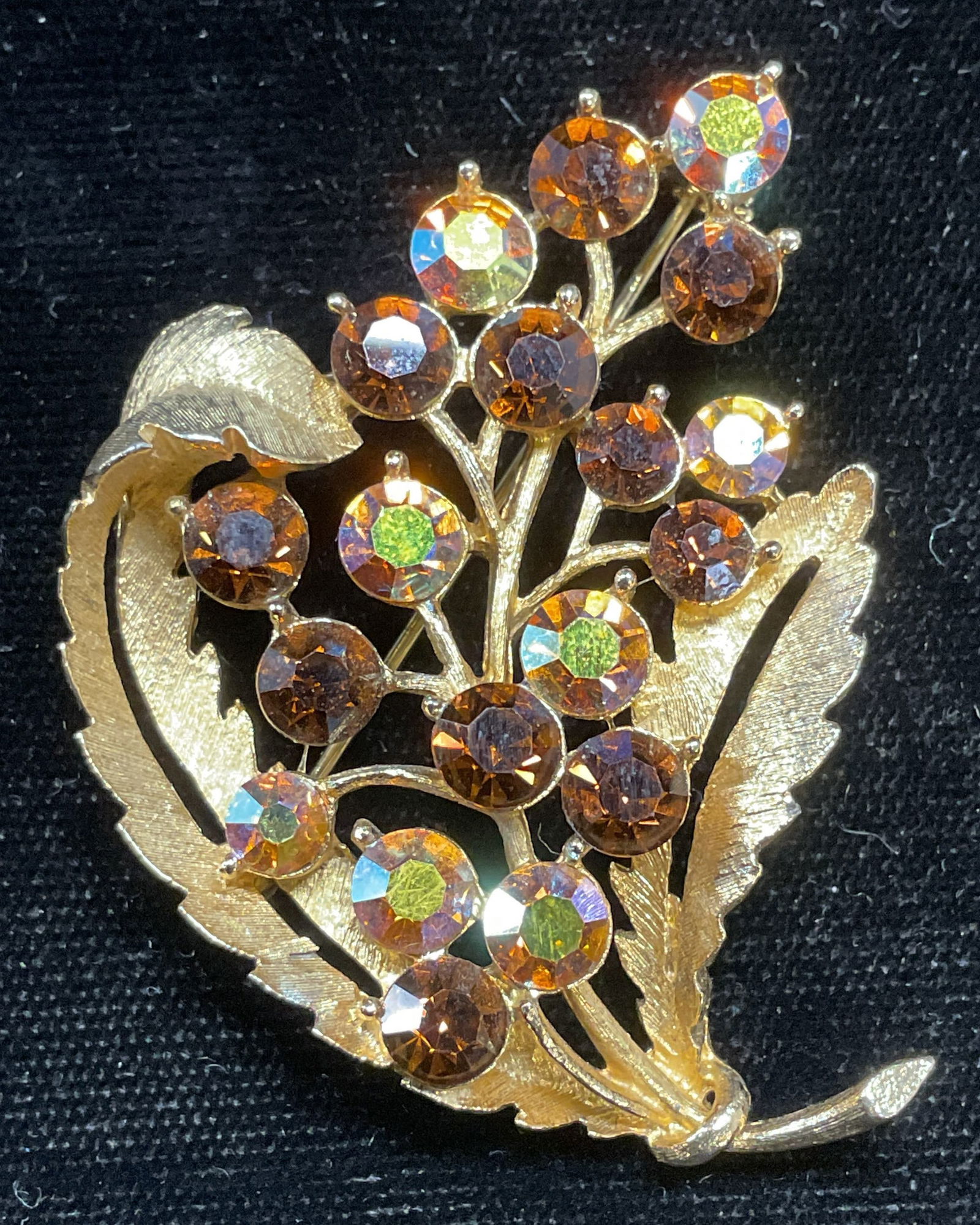 Vintage Gold Tone Crystal Flower Brooch: Vintage gold tone flower motif brooch with amber toned crystals. Measures approx 2 x 1.5 inches. Some scratching. Jewelry, estate jewelry, costume jewelry, cocktail jewelry, fashion jewelry, accessori