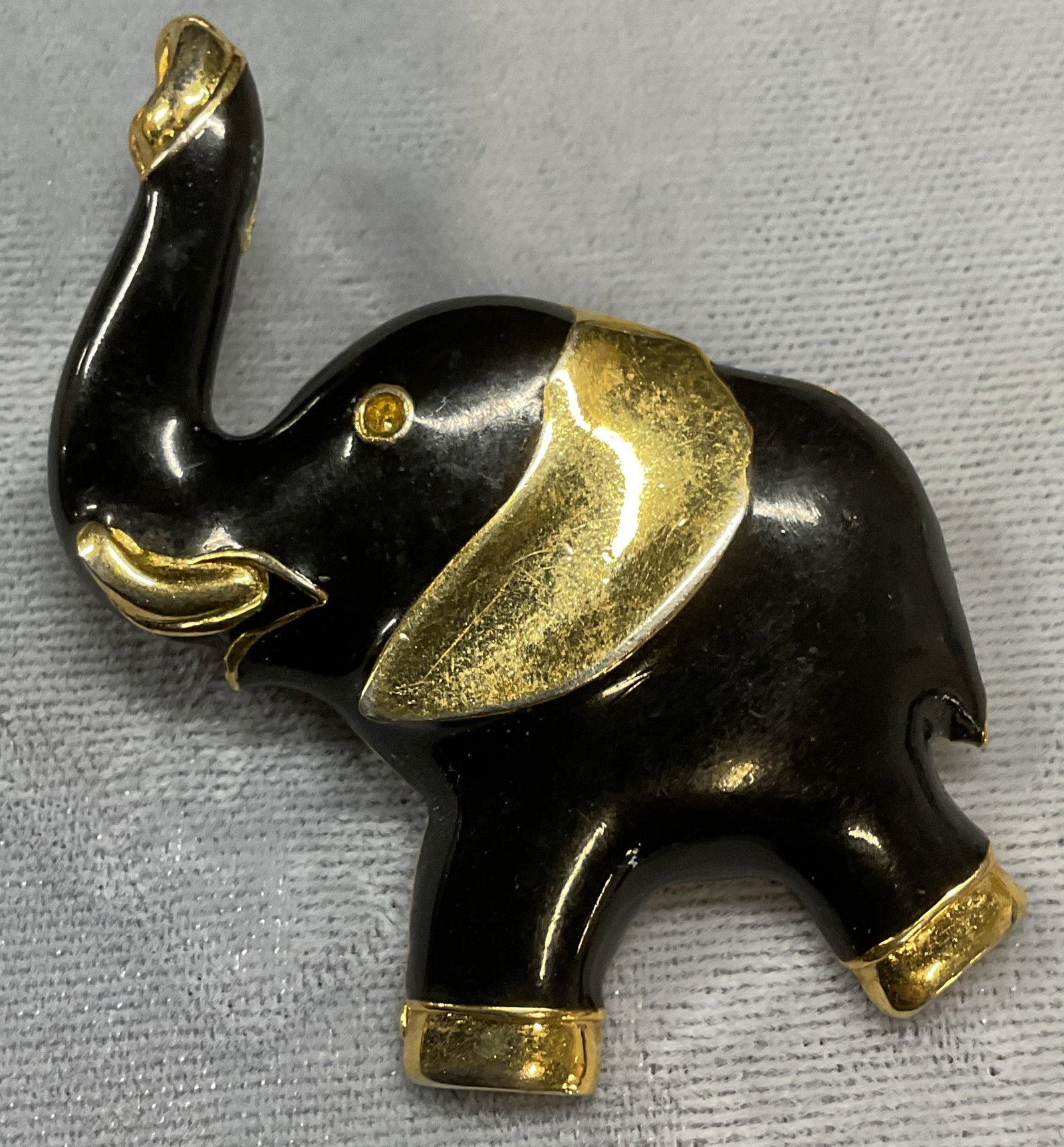 Vtg Gerrys Black Enamel Elephant Brooch: Vintage Gerrys gold tone and black enamel elephant motif brooch. Signed. Measures approx 1.75 x 1.5 inches. Some scratching. Jewelry, estate jewelry, costume jewelry, cocktail jewelry, fashion jewelry