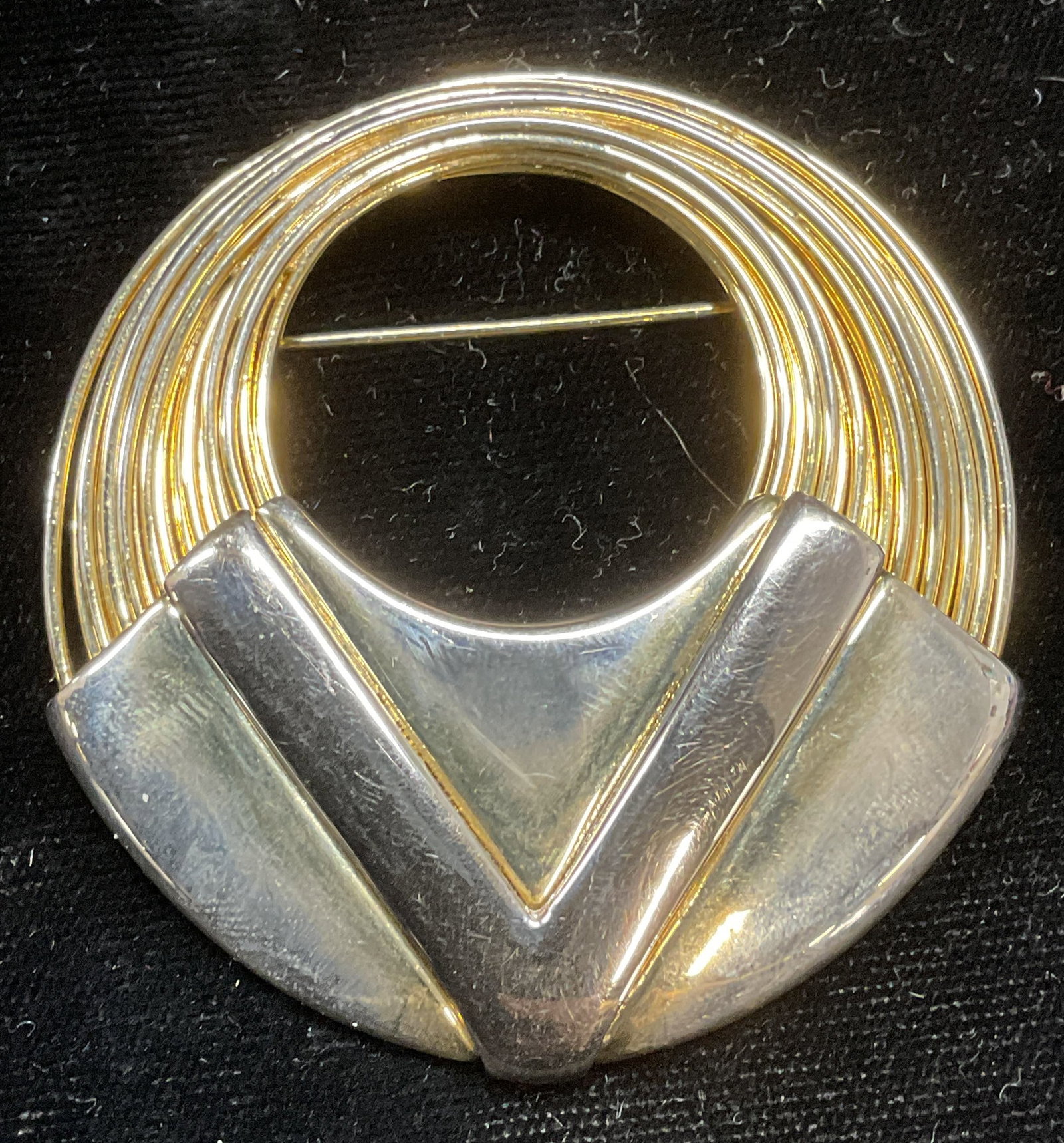Vintage Gold Tone Open Circle Brooch: Vintage gold tone open circle wire brooch with V motif. Measures approx 2.25 inches wide. Some scratching. Jewelry, estate jewelry, costume jewelry, cocktail jewelry, fashion jewelry, accessories, fas