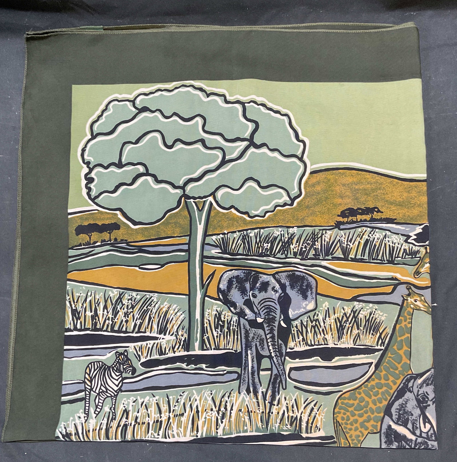 Out Of Africa Green Animal Print Scarf: Out of Africa handmade green animal print scarf. Synthetic material. Measures approx 40 x 40 inches. Some wear consistent with exposure. Out of Africa scarf, designer scarf, green scarf, animal scarf,