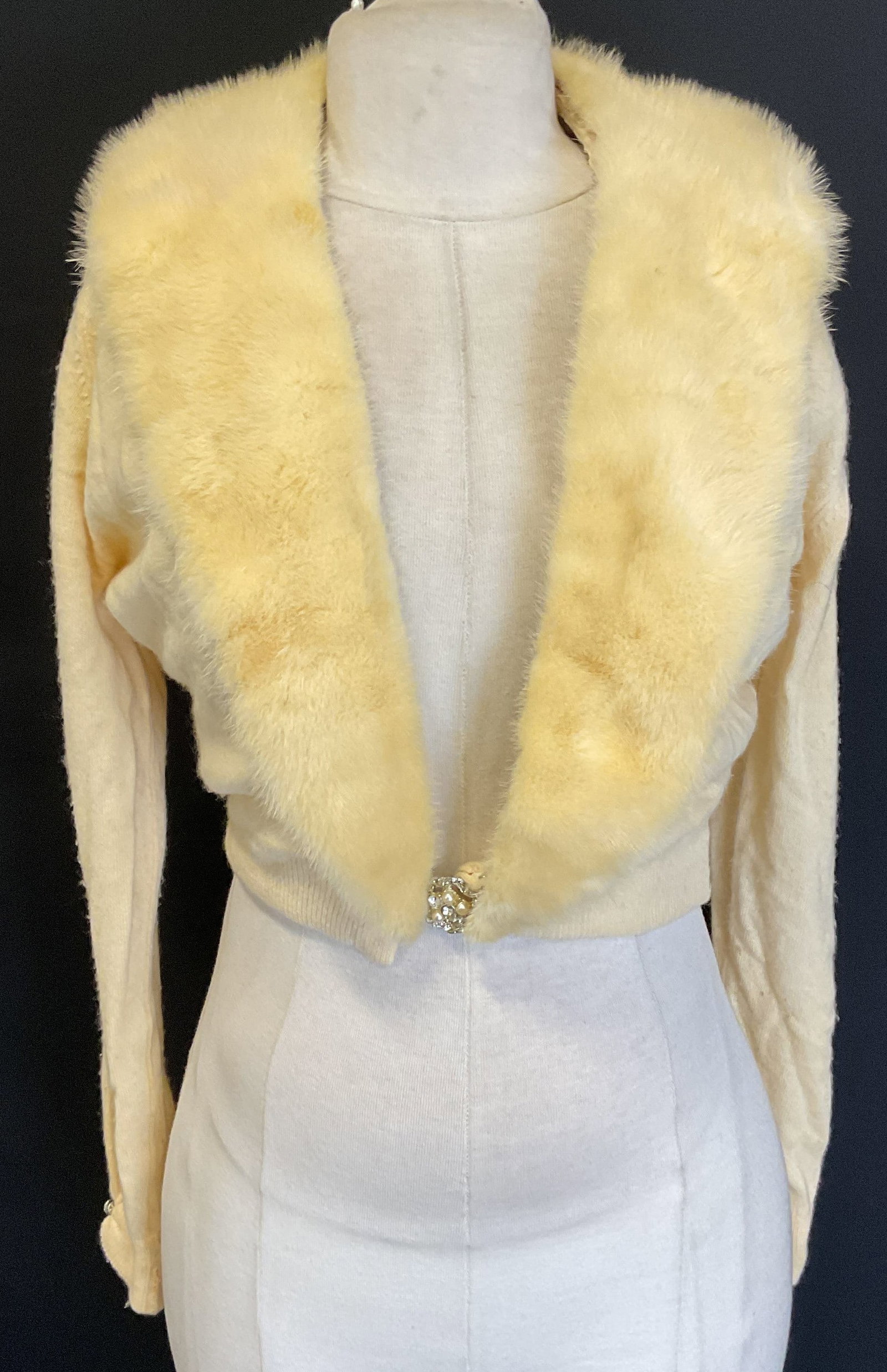 Vintage Hadley White Cashmere Fur Sweater: Vintage Regalia Furs Hadley Cashmere sweater. White cashmere with removable fur trim. Faux pearl and crystal clasp. Mesh lining. Measures approx 16 inches across chest. Some pilling and blemishes. Had