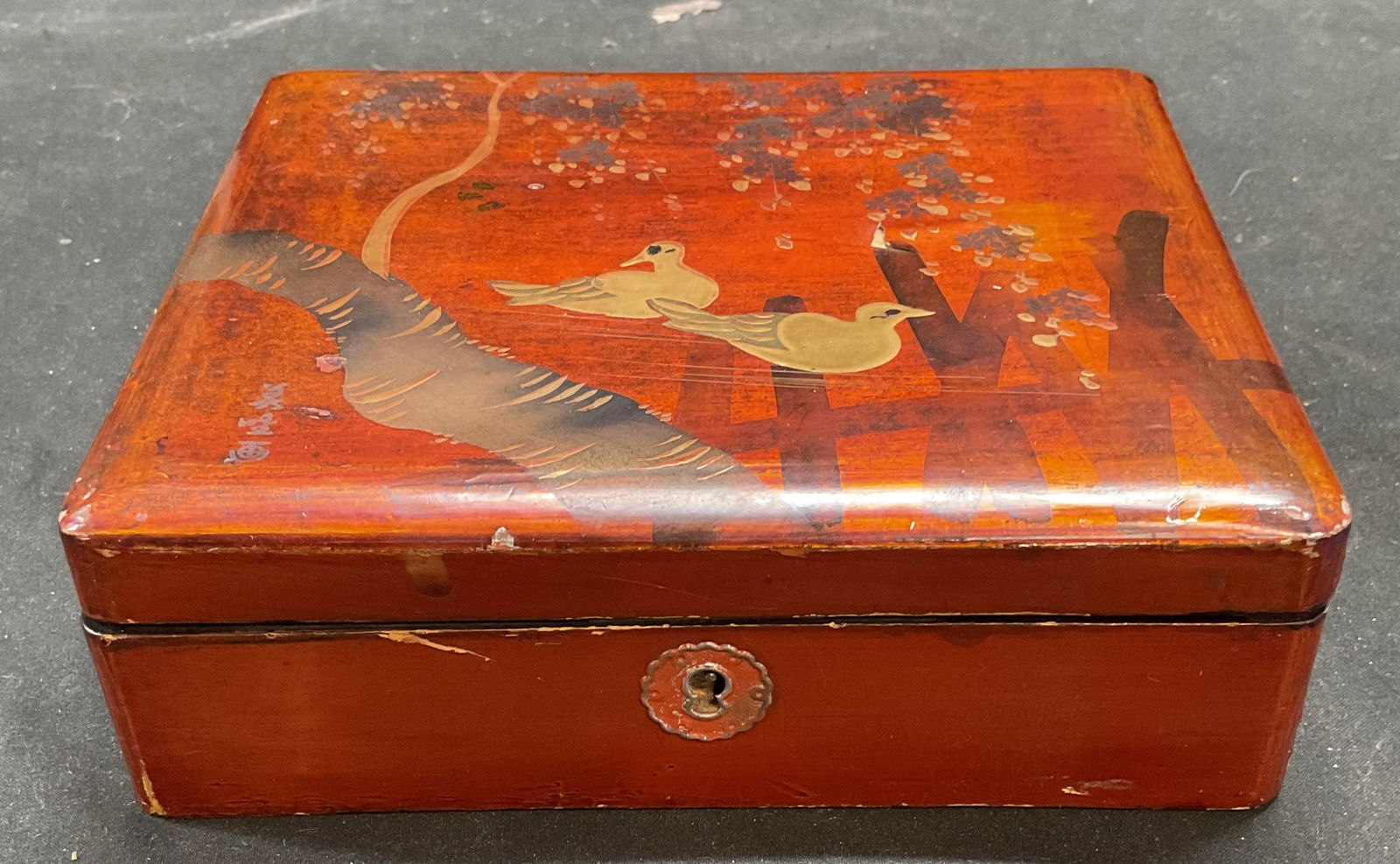Vtg Asian Style Lacquered Gilt Wood Jewelry Box: Vintage Asian style lacquered wood jewelry box. Hand painted with gilt decoration. Bird and landscape motifs. Measures approx 6.75 x 6 x 2 inches. Some wear including scratching and chips. Jewelry box