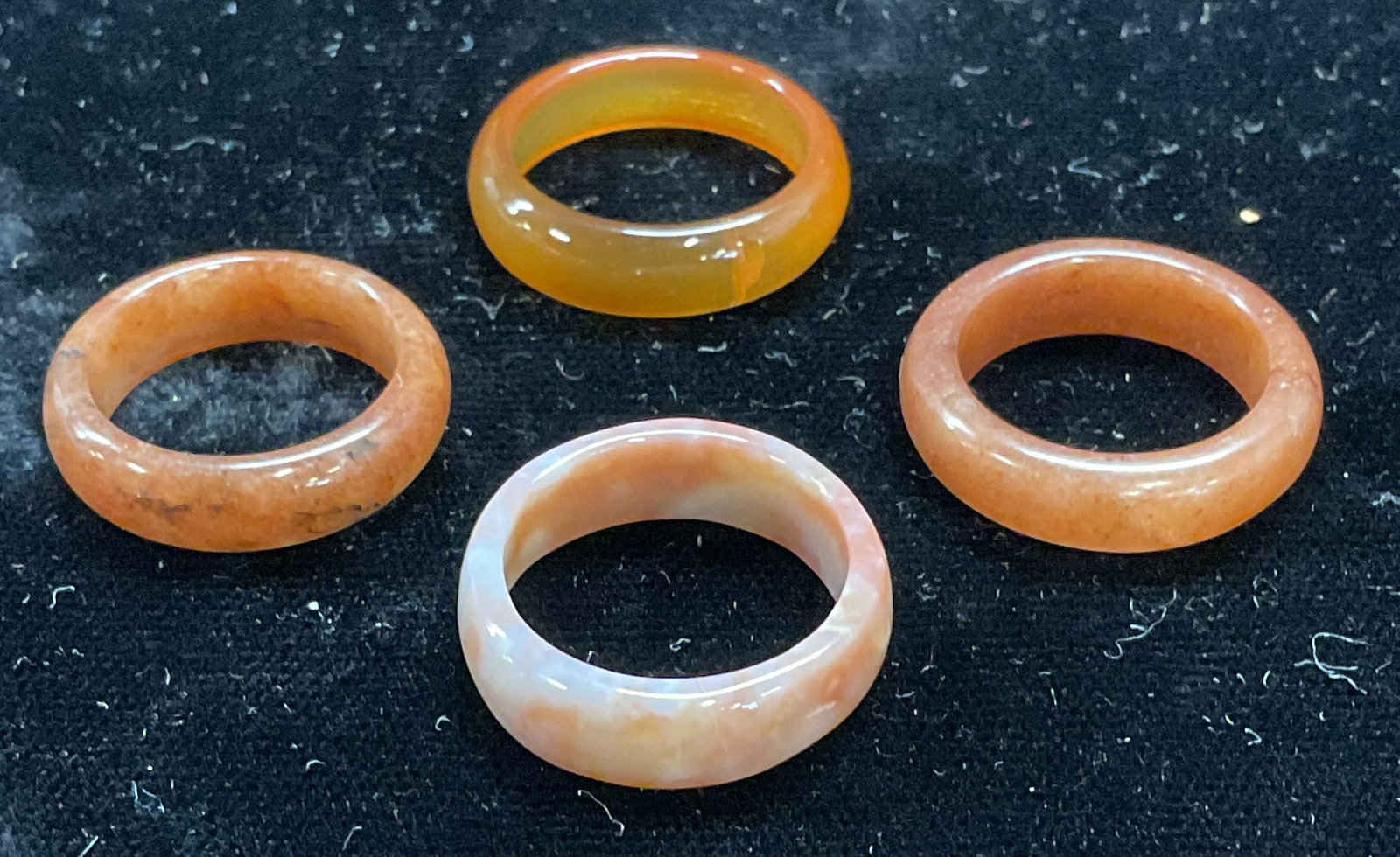 Lot 4 Carved Orange Semiprecious Rings: Lot of 4 carved and polished orange toned semiprecious stone rings. Larges ring size 6.5. Some scratching. Jewelry, estate jewelry, costume jewelry, cocktail jewelry, fashion jewelry, accessories, fas