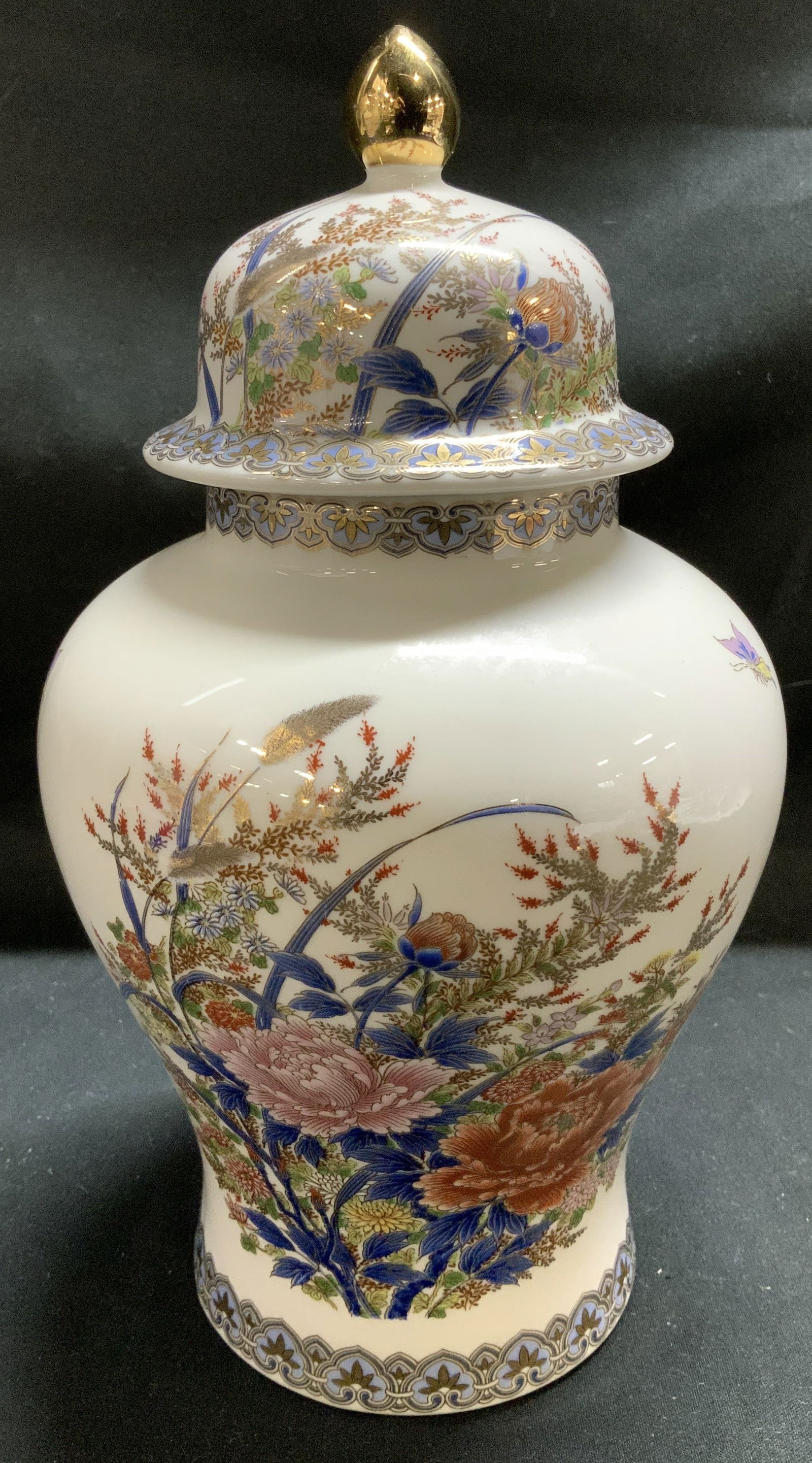 Vntg SHIBATA Porcelain Floral Ginger Jar JAPAN: Ginger is porcelain material & features a hand-painted floral design w butterflies & gold accents. Lid is topped w gold finial. Signed & marked on underside. Reads, SHIBATA JAPAN. Surface wear consist