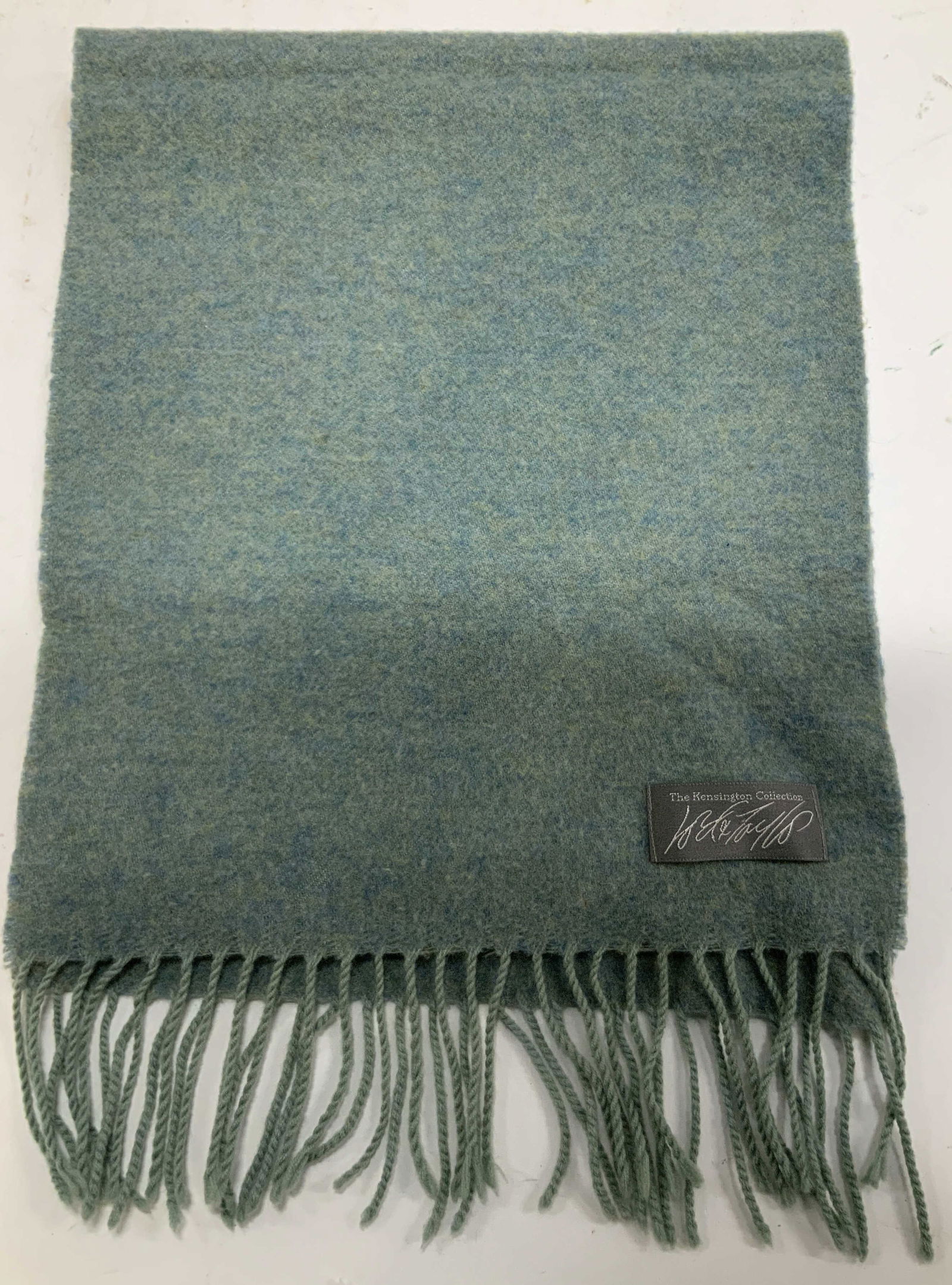 Kensington Collection Lord&Taylor Wool Felt Scarf: Scarf appears to be wool. Features a light, mottled blue tone. Fringed ends. Signed & marked. Reads, THE KENSINGTON COLLECTION. LORD & TAYLOR. Surface wear consistent to age, use & exposure. Measureme