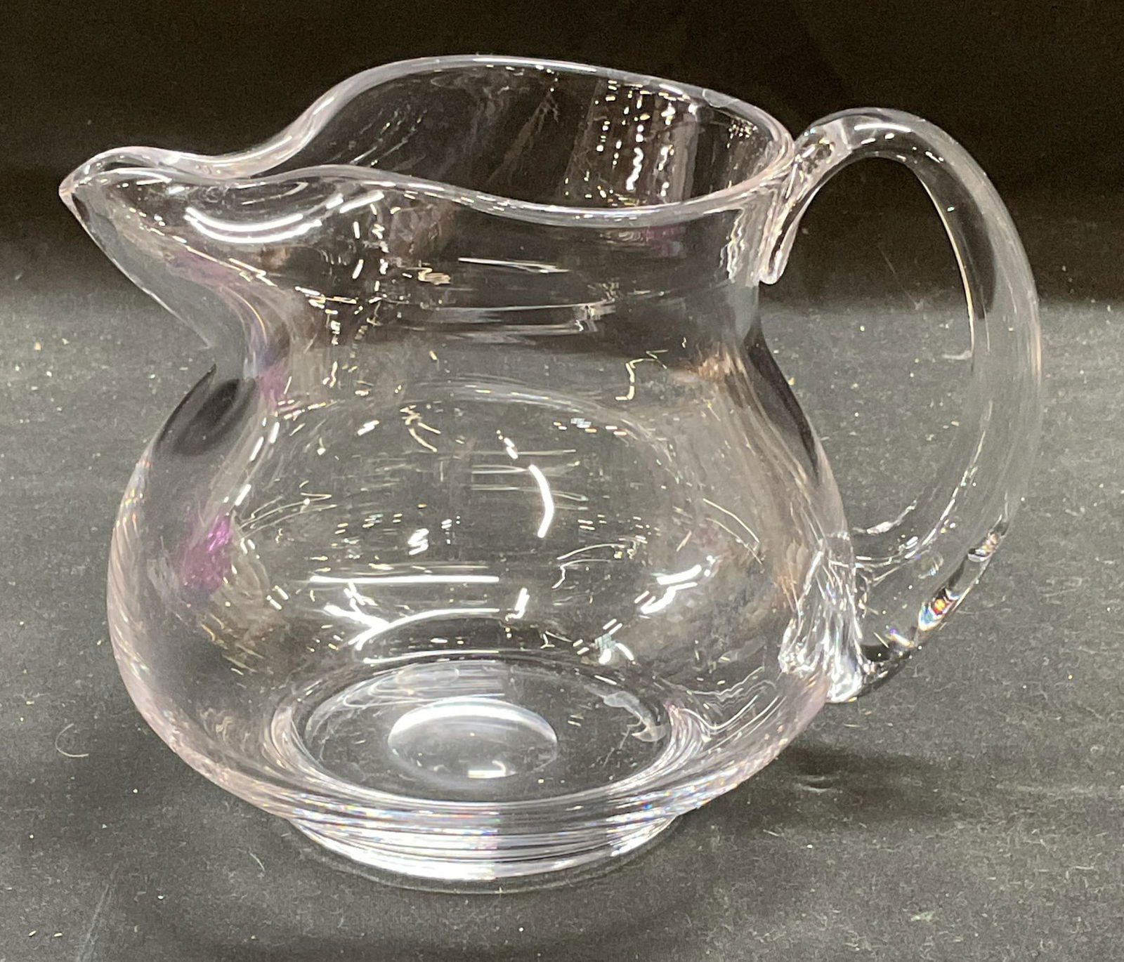 Hand Blown Clear Art Glass Pitcher: Hand blown clear art glass pitcher. Measures approx 6 x 4.5 x 5 inches. Some wear including scratching observed. Pitcher, glass pitcher, art glass pitcher, tableware, table accessories, homewares, hom