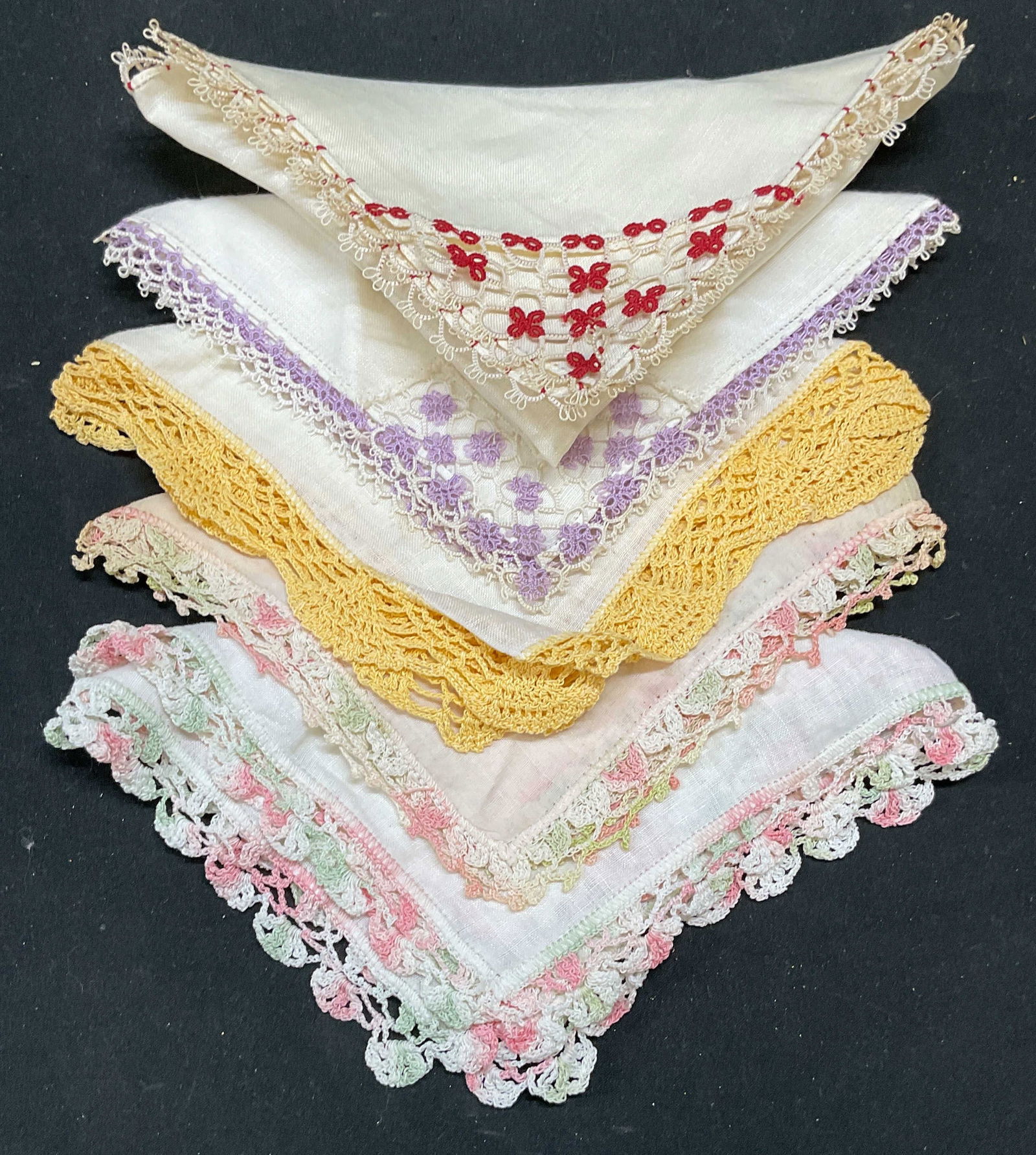 Lot 5 Vintage Cotton Lace Handkerchiefs: Lot of 5 vintage white cotton and linen multicolor lace trim handkerchiefs. Sizes vary. Red lace trim handkerchief approx 11 x 11 inches. All pieces have wear including blemishes. Handkerchief, white