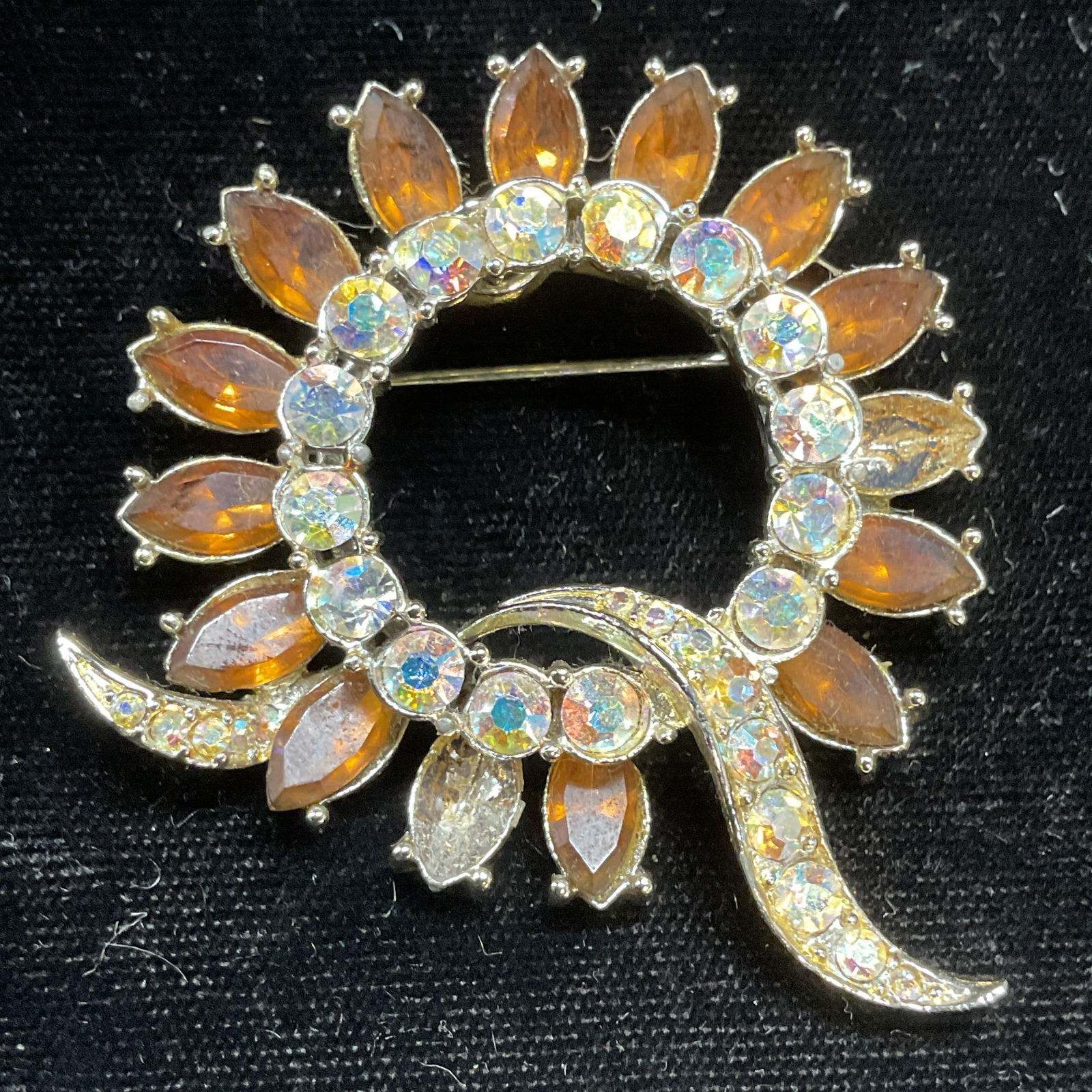 Vintage STAR Crystal Flower Brooch: Vintage STAR silver tone amber and colorless crystal, flower motif brooch. Signed. Measures approx 2.25 x 2 inches. Two crystals needs replacement. Some scratching. Jewelry, estate jewelry, costume je