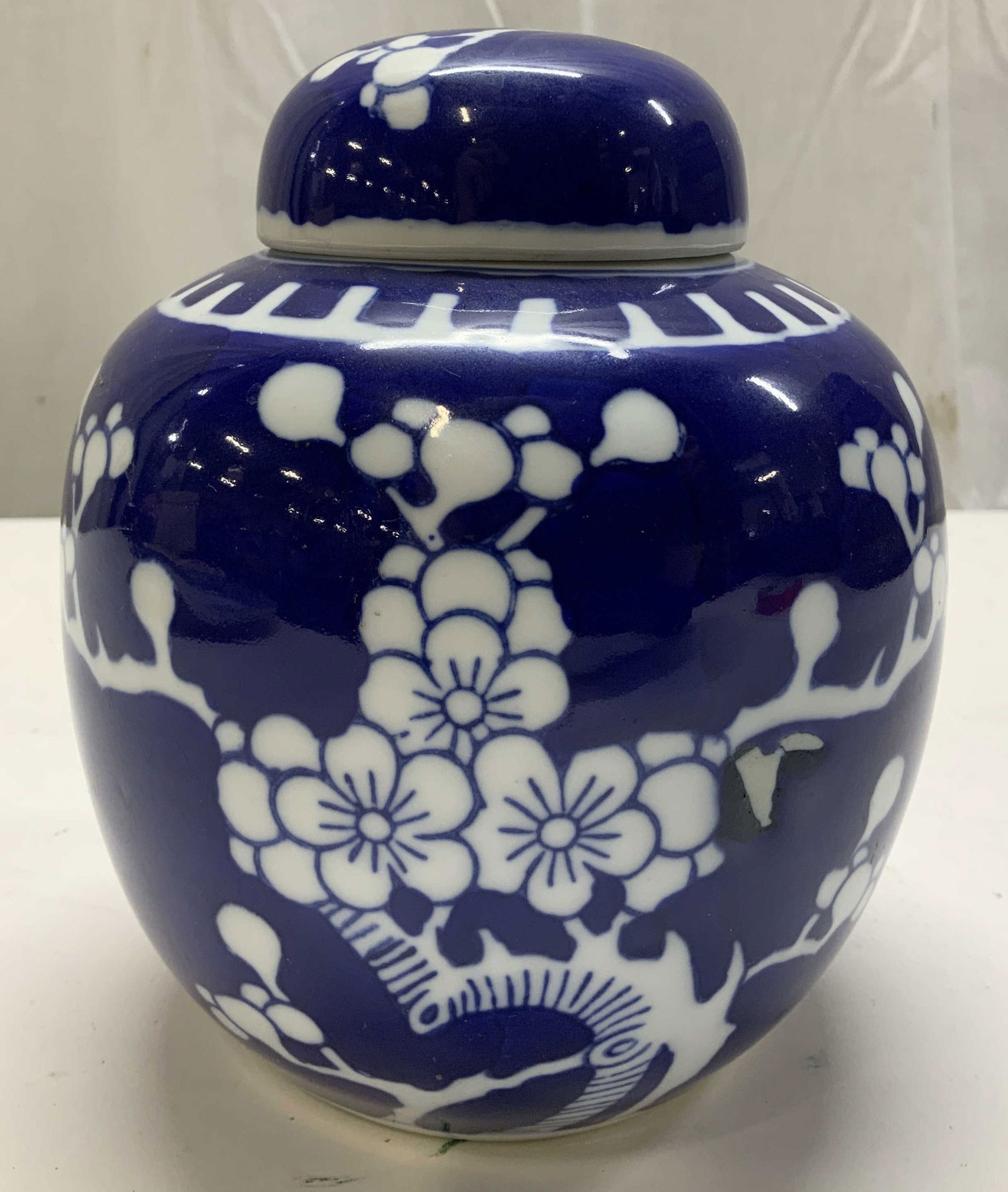 Vntg Prunus Blossom Motif Porc Ginger Jar: Ginger jar is porcelain material & depicts prunus blossom motifs. Cobalt blue & white tones. Comes with lid. Surface wear consistent to age, use & exposure. Measurements: length 2.4in x width 2.4in x