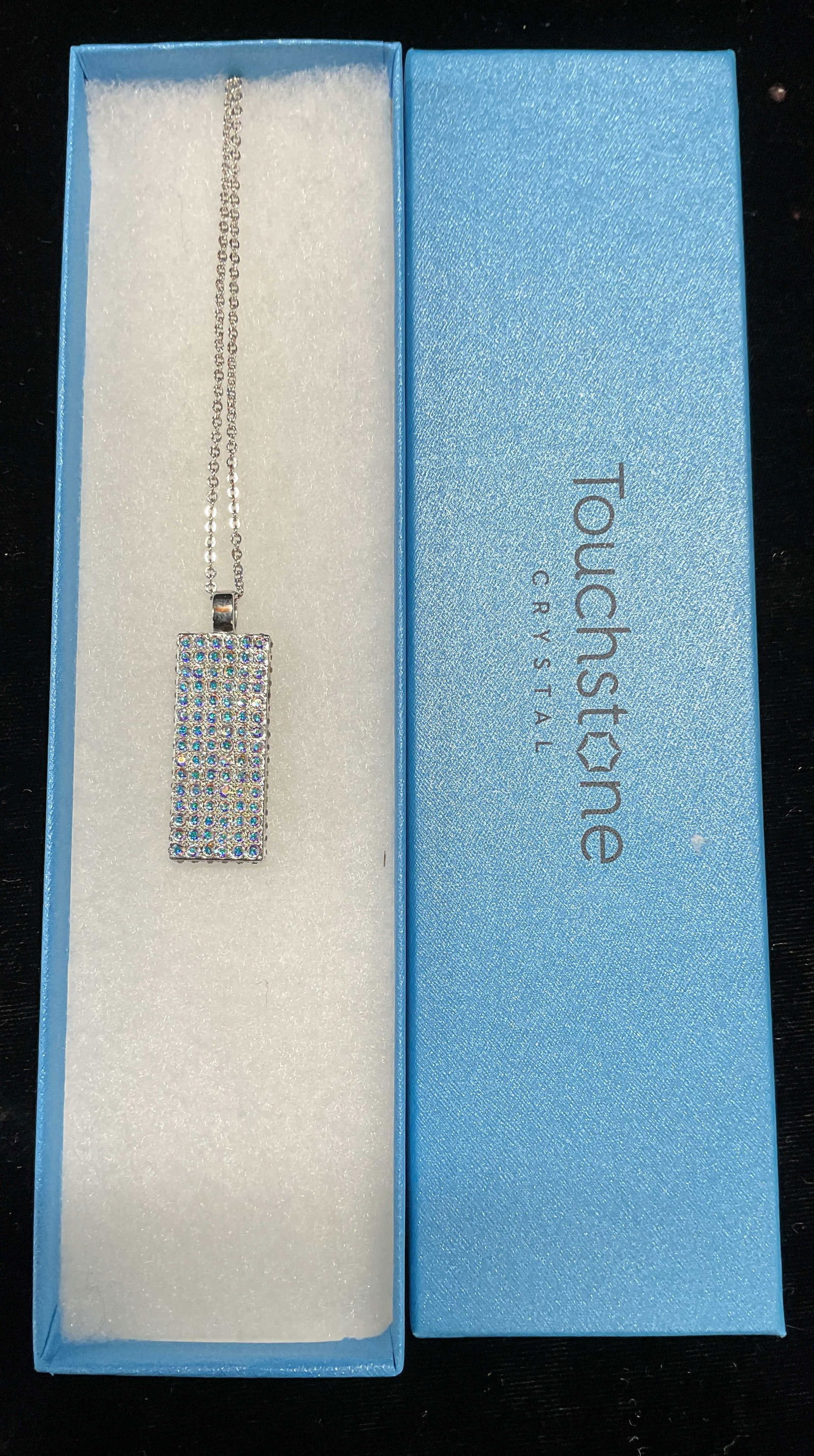 Swarovski Touchstone Crystal Pendant Necklace NIB: Touchstone by Swarovski silver tone crystal pendant necklace. Signed. New in box. Drop length approx 17 inches. Some scratching. Jewelry, estate jewelry, costume jewelry, cocktail jewelry, fashion jew