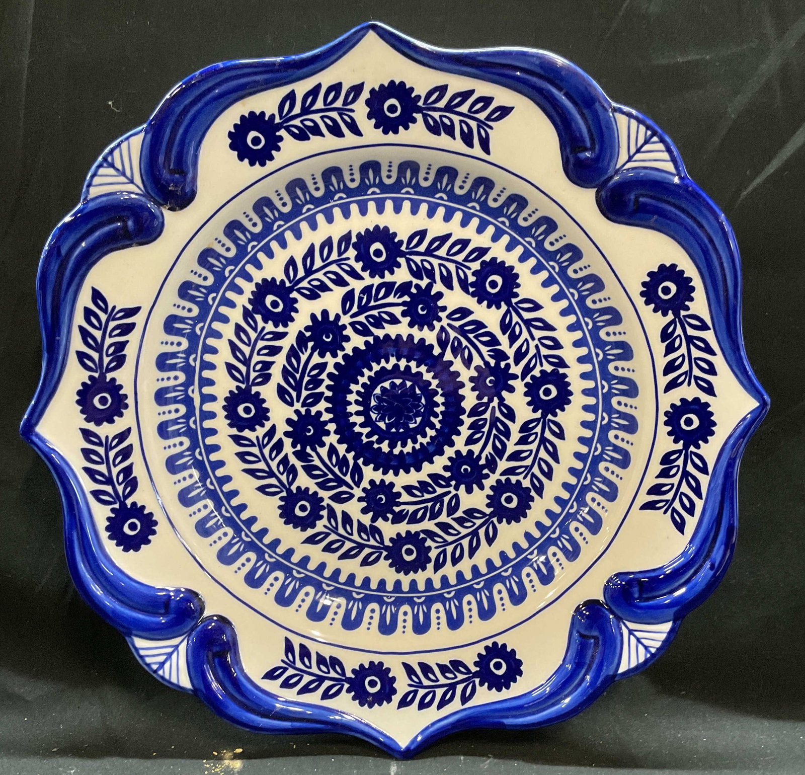 ND Blue & White Floral Porcelain Platter: Signed ND hand painted blue and white scalloped rim platter with floral design. Measures approx 14 inches. Platter has weight. Some scratching. Nd platter, porcelain platter, floral platter, blue and 