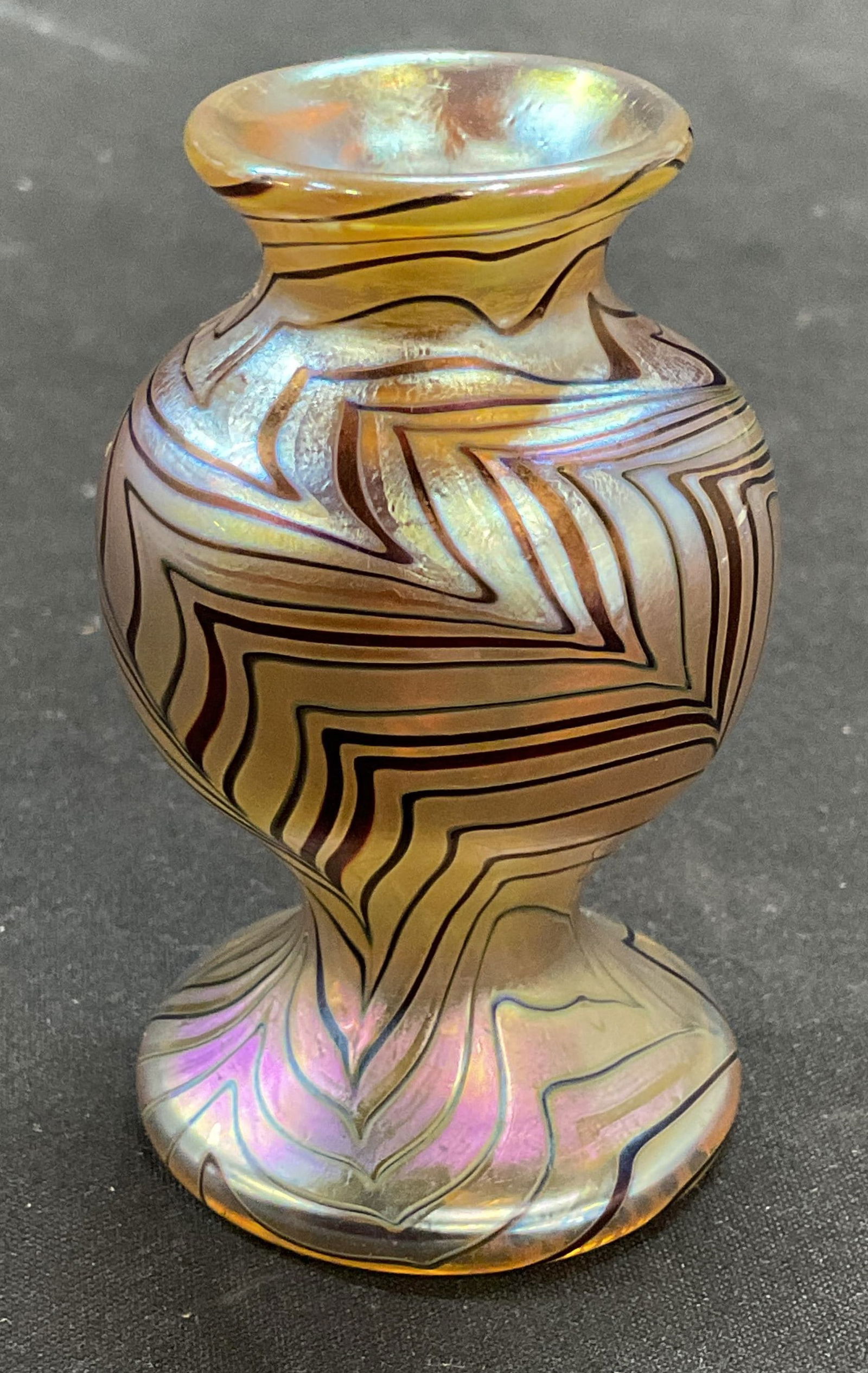 Orient & Flute Iridescent Art Glass Bud Vase: Orient & Flume hand blown iridescent art glass bud vase. Feather pull design. Signed and numbered on underside. Measures approx 1.5 x 2.75 inches. Minimal surface wear. Orient and flume vase, art glas
