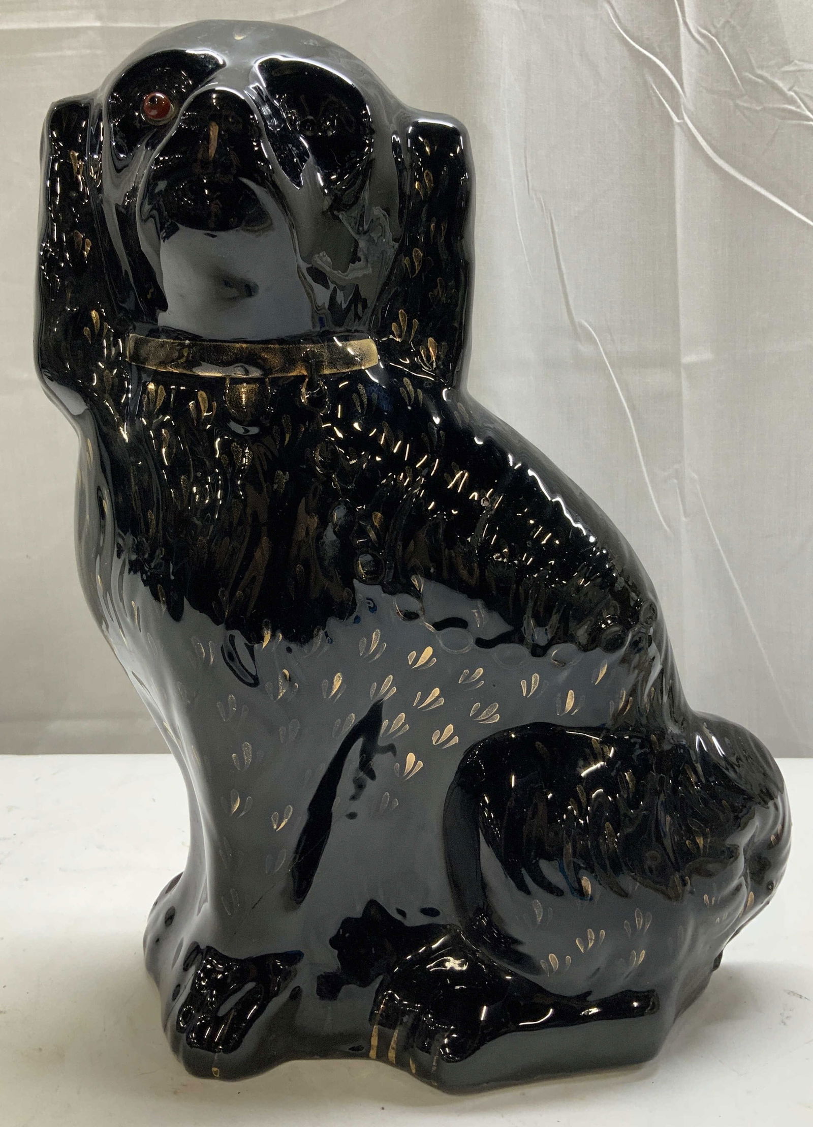 Vntg Staffordshire Style Black Dog Ceramic Fig.: Depicts a black dog w red eyes & gold accents. Figurine is ceramic & features a Staffordshire style. Glossy finish. No visible signature or markings. Surface wear consistent to age, use & exposure. Mi