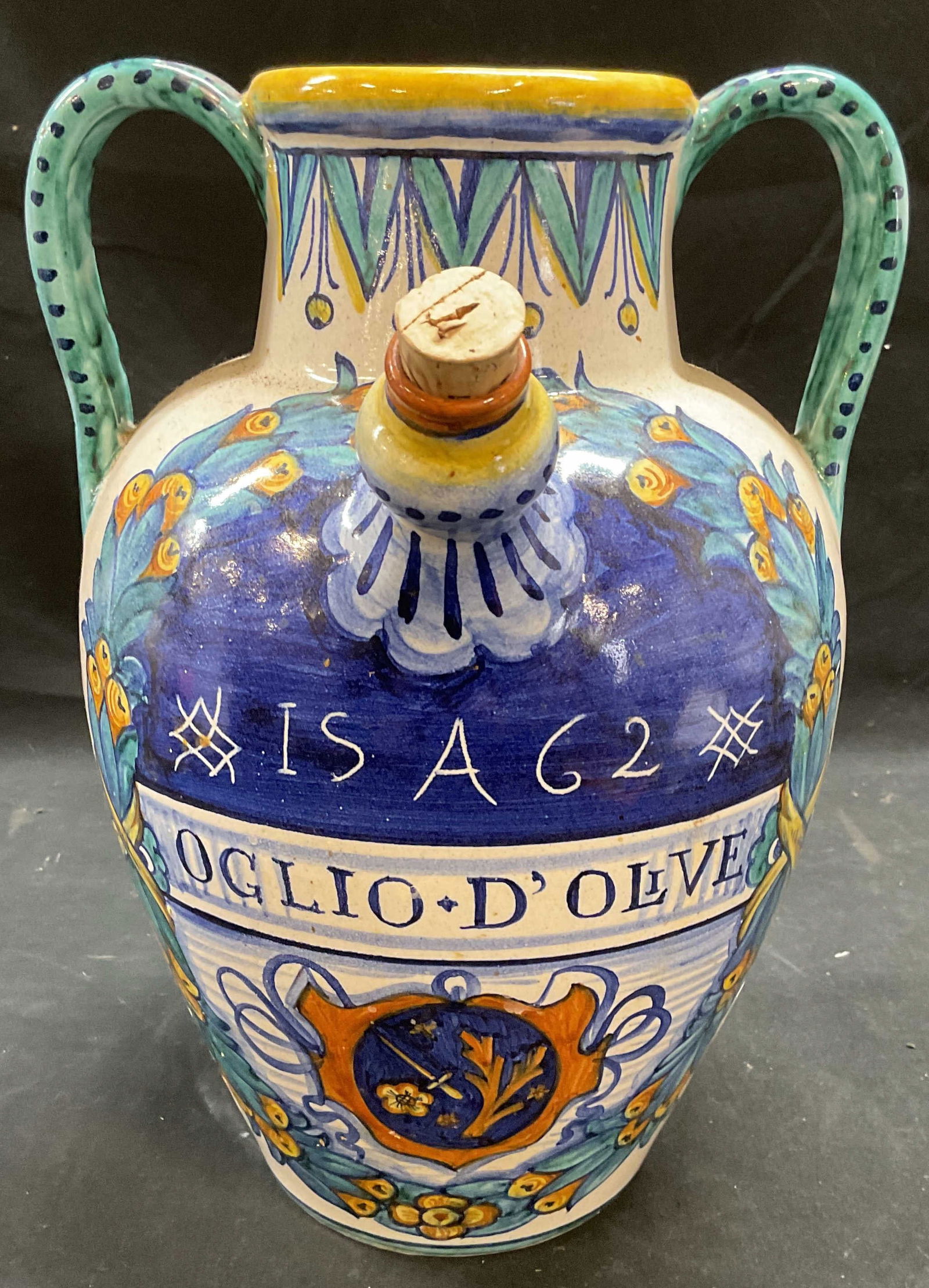 Vtg Sberna Deruta Majolica Olive Oil Jug Italy: Vintage handmade Sberna Deruta majolica pottery jug. Reads Olive Oil. Hand Painted with olive branch motif. Handles and spout. Signed on underside. Made in Italy. Measures approx 8 x 11 inches. Some w