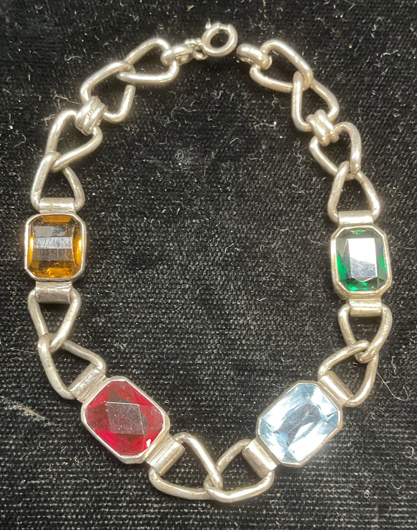 Vintage Sterling Silver Crystal Bracelet: Vintage sterling silver bracelet with multicolor crystals. Tests for sterling. Measures approx 6.75 inches long. Total weight 14.7 grams. Some wear including scratching observed. Jewelry, estate jewel
