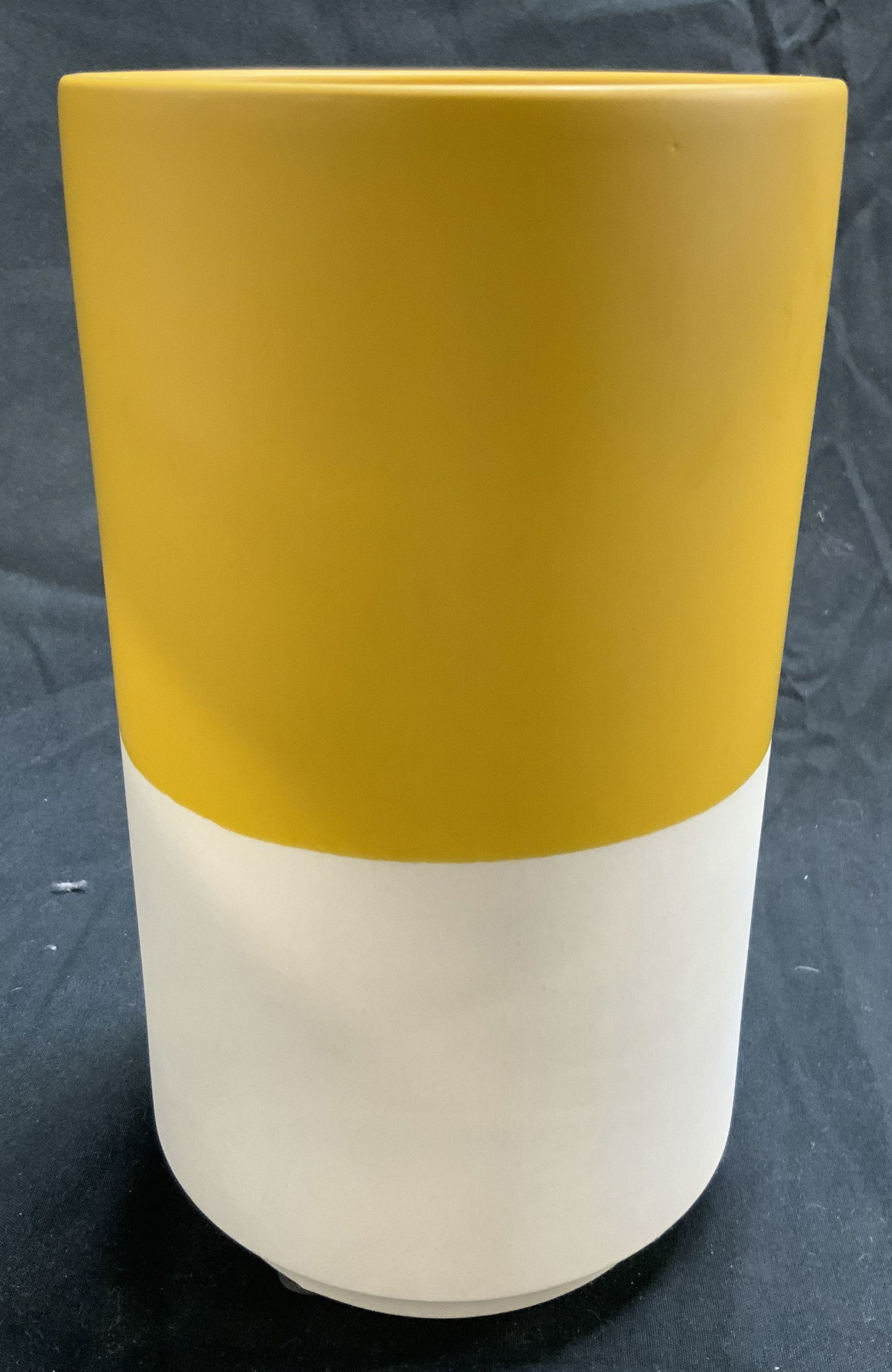 Trademarked 2 Toned Cylindrical Ceramic Vase: Vase is trademarked on underside (appears to be MIKASA). Piece has Cylindrical form. Vase is two toned with yellow and cream tones. Piece measures approximately 8 inches tall 4.5 inches wide. Vase, ce