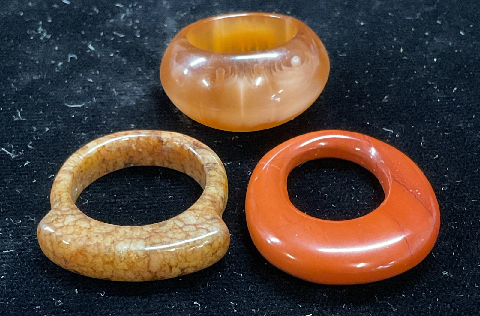 Lot 3 Red & Tan Semiprecious & Lucite Rings: Lot of 3 Semiprecious stone and lucite band rings. Red and tan toned. Ring sizes 2.75, 4.75 and 7.25. Some scratching. Jewelry, estate jewelry, costume jewelry, fashion jewelry, cocktail jewelry, acce