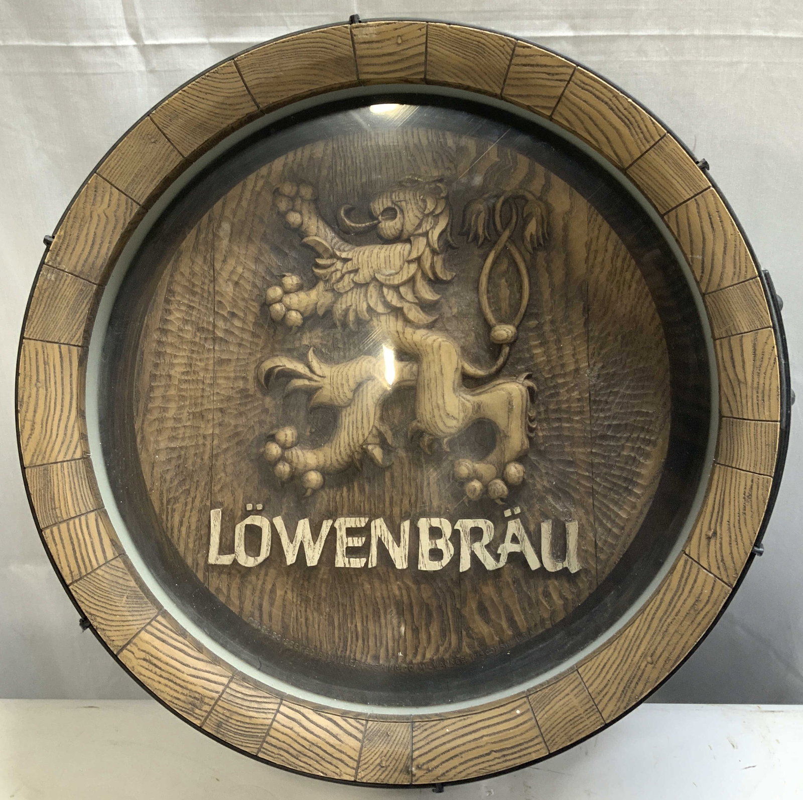 Vntg Lowenbrau Beer Barrel Illuminated Wall Sign: Sign is circular & designed to resemble the end of a wooden beer barrel. It is made of plastic with a faux wood finish. Center of sign reads, LOWENBRAU. Has not been tested for function. Lot is sold a