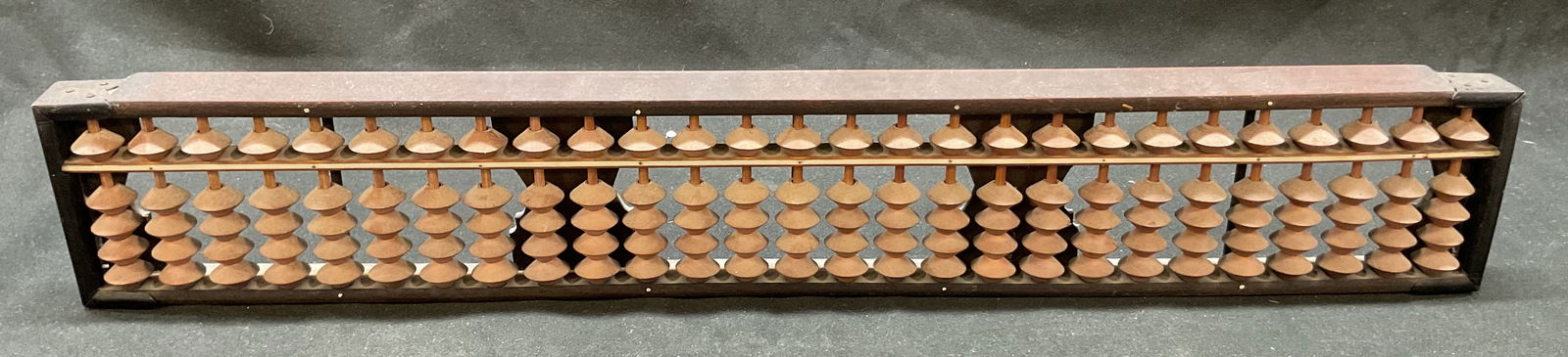 Vtg Chinese Wooden Abacus (Soroban) Bristol Japan: Vintage Chinese wooden abacus (soroban) Bristol. 27 rods, 135 beads. Dark brown wooden frame, light brown beads. Made in Japan. Measures approx 15 1/4 in long by 2 1/2 in by 3/4 in. Some surface wear