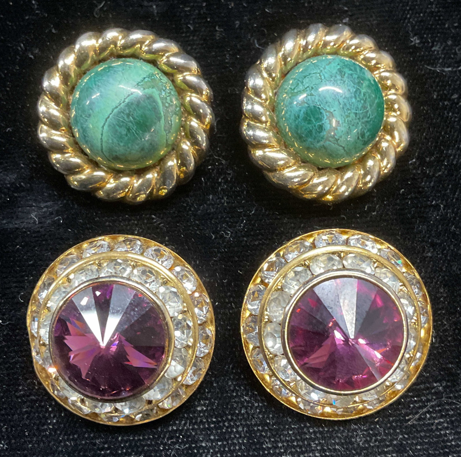 Lot 2 Gold Tone Semiprecious & Crystal Earrings: Lot of 2 pairs of vintage gold tone earrings with green Semipr3cious stone cabochons and purple and colorless crystals. Measure approx 1 inch wide. Some scratching. Jewelry, estate jewelry, costume je