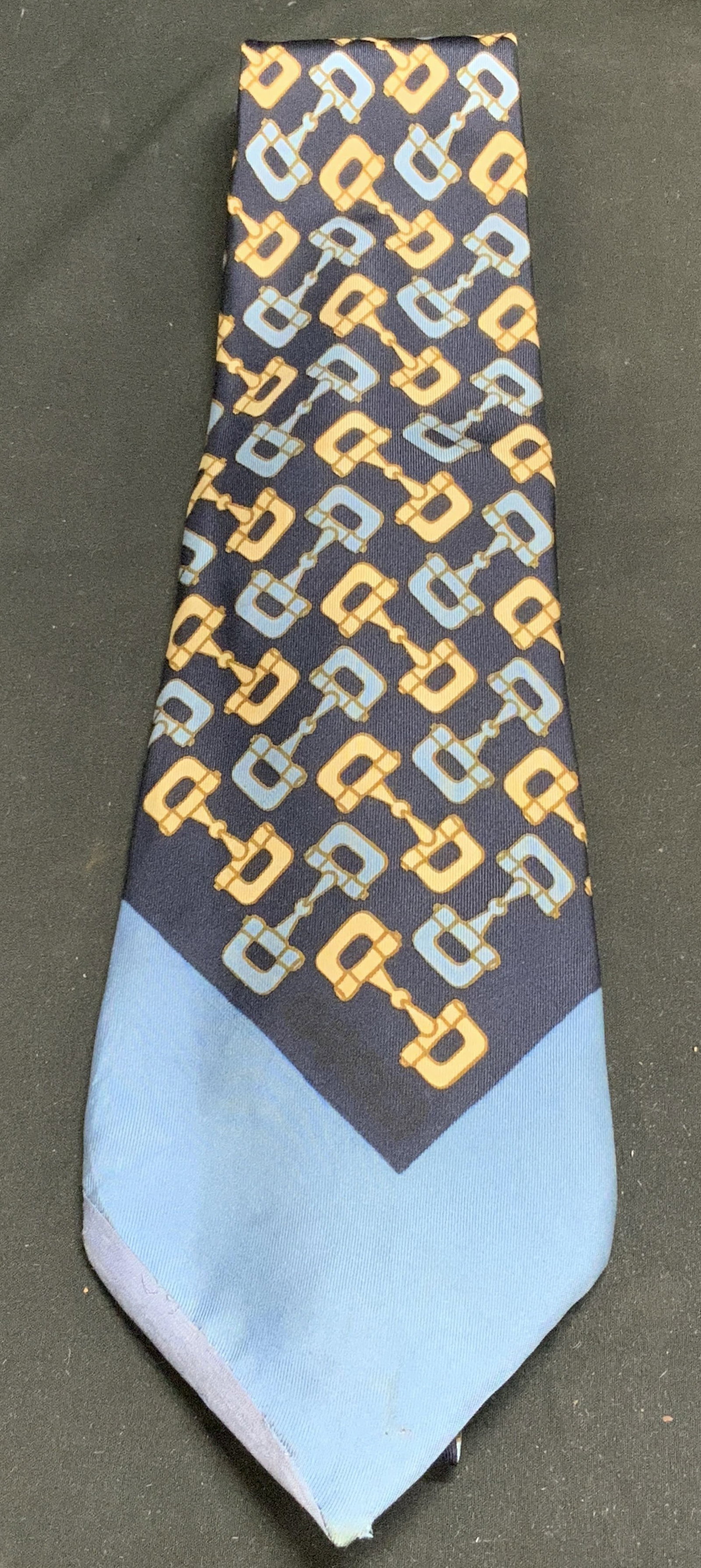 Vntg Gucci Navy Horsebit Silk Necktie ITALY: Necktie is silk material & features a repeating horsebit pattern in gold & blue tones. Signed & marked. Reads, GUCCI. ALL SILK MADE IN ITALY. Surface wear consistent to age, use & exposure. Measuremen