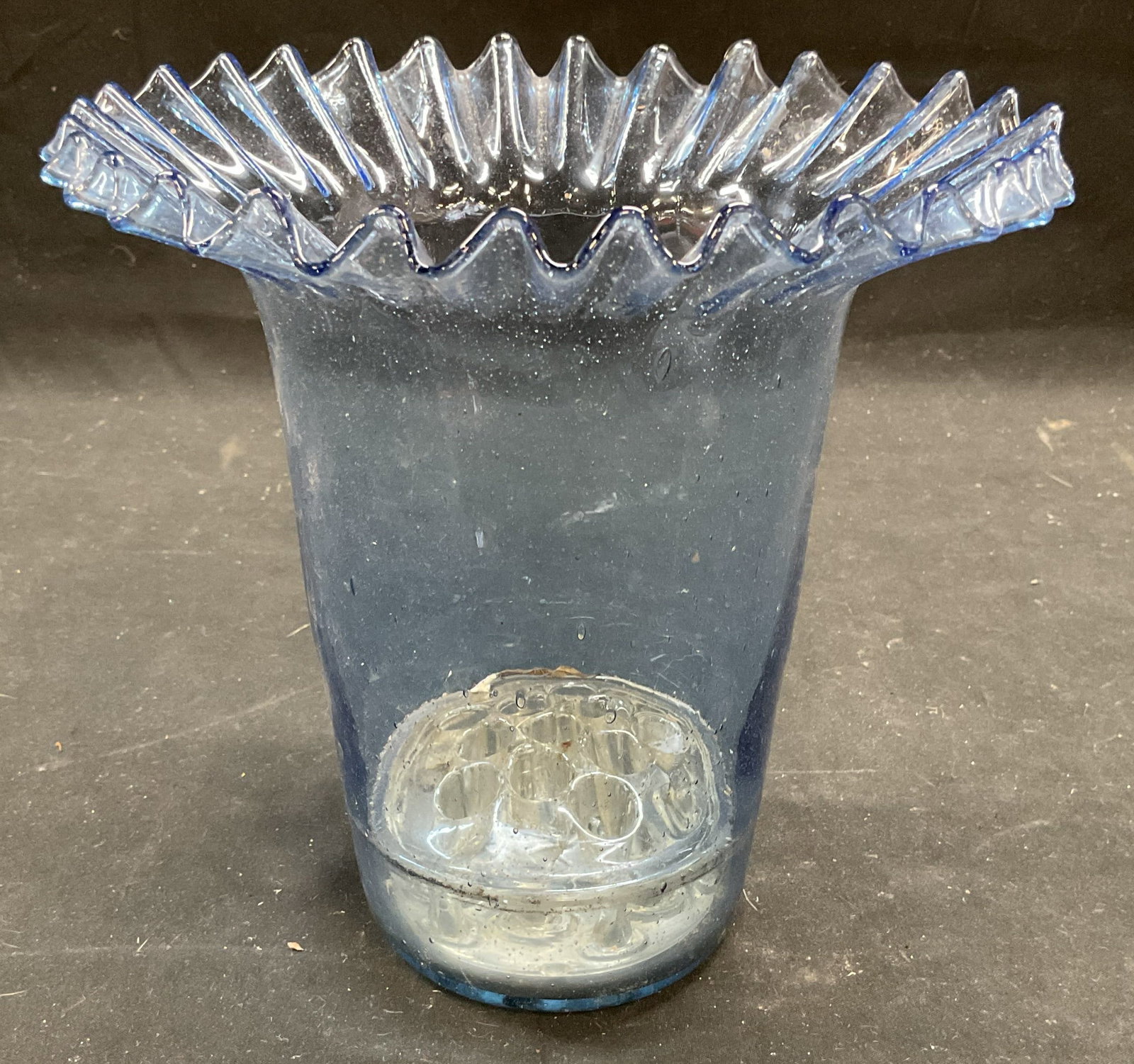Blown Blue Glass Ruffle Flower Arranging Vase: Vintage blown art glass vase with ruffle rim and applied flower frog on interior. Measures approx 7 x 7 inches. Some scratching and residue. Art glass vase, blue vase, ruffle vase, flower frog vase, f