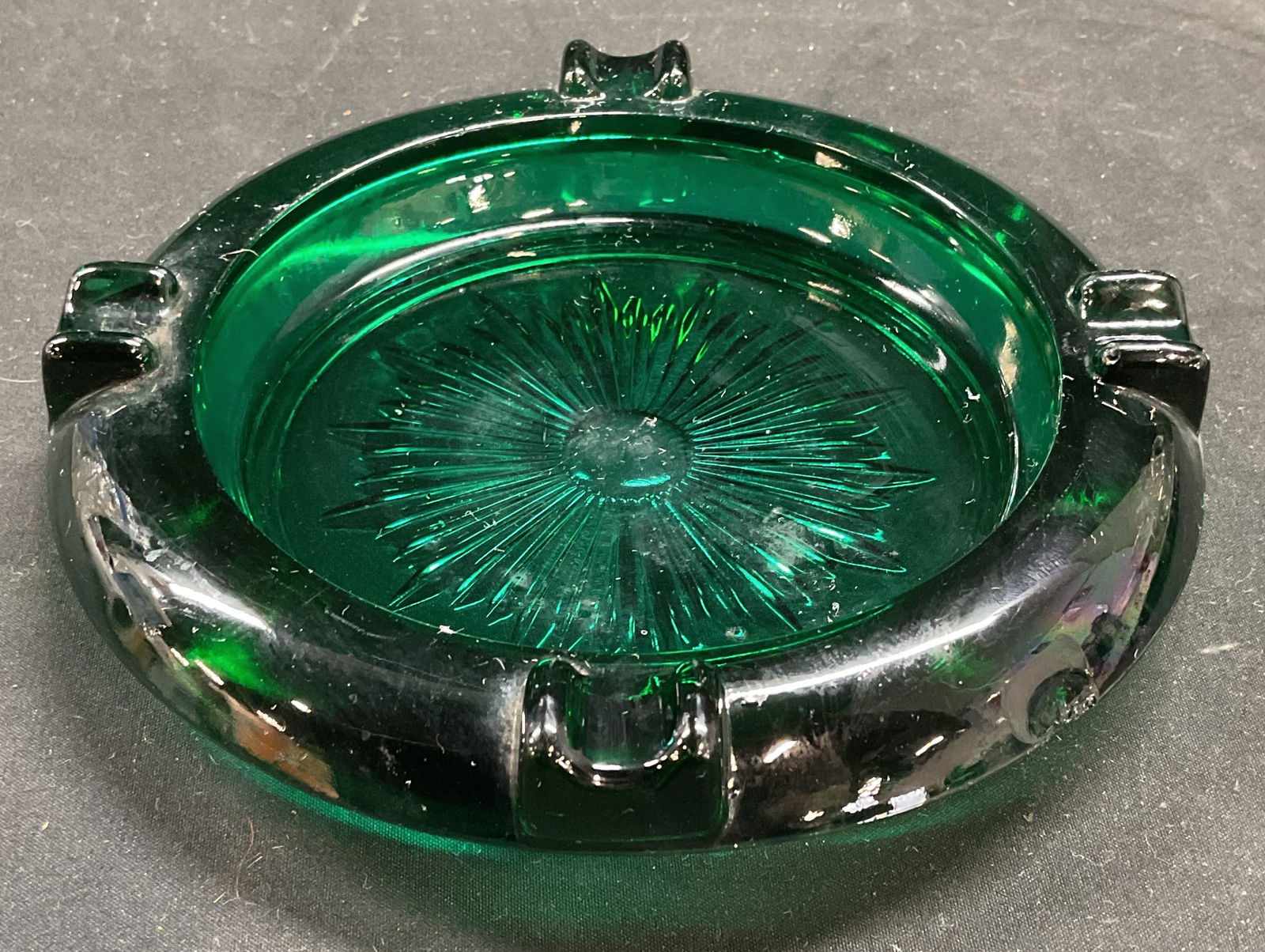 Vintage Emerald Green Glass Ashtray: Vintage emerald green pressed glass ashtray. Measures approx 6.5 x 1.25 inches. Some scratching and small chips. Ashtray, green ashtray, glass ashtray, collectibles, home decor, home accessories, tabl