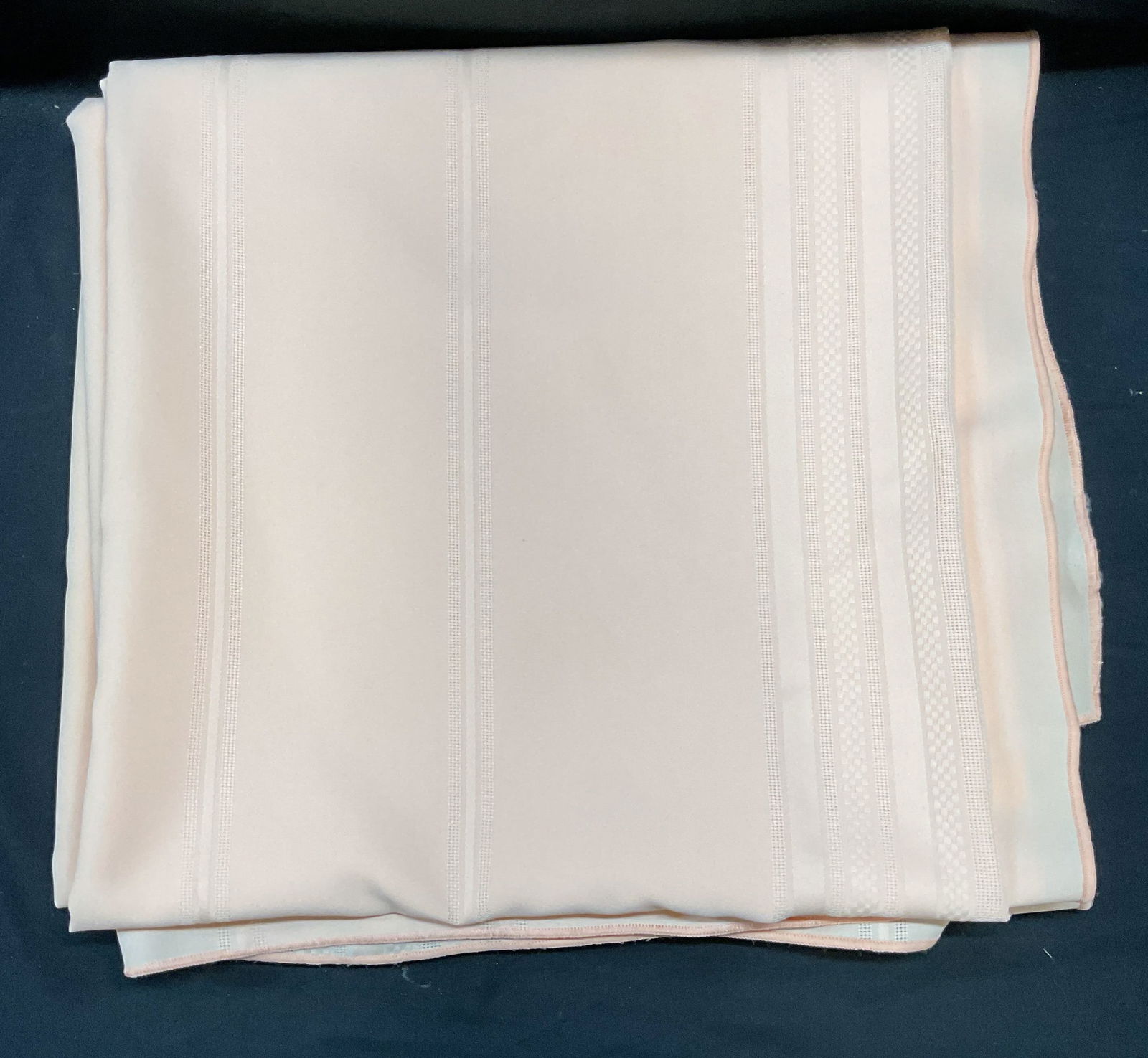 Pink Striped Tablecloth 5.5+ Feet long: Pink tablecloth embroidered contrasting striped detail. Feels like synthetic blend. Measures approx 70 inches long. Previously professionally cleaned. Some wear to material consistent with exposure. B