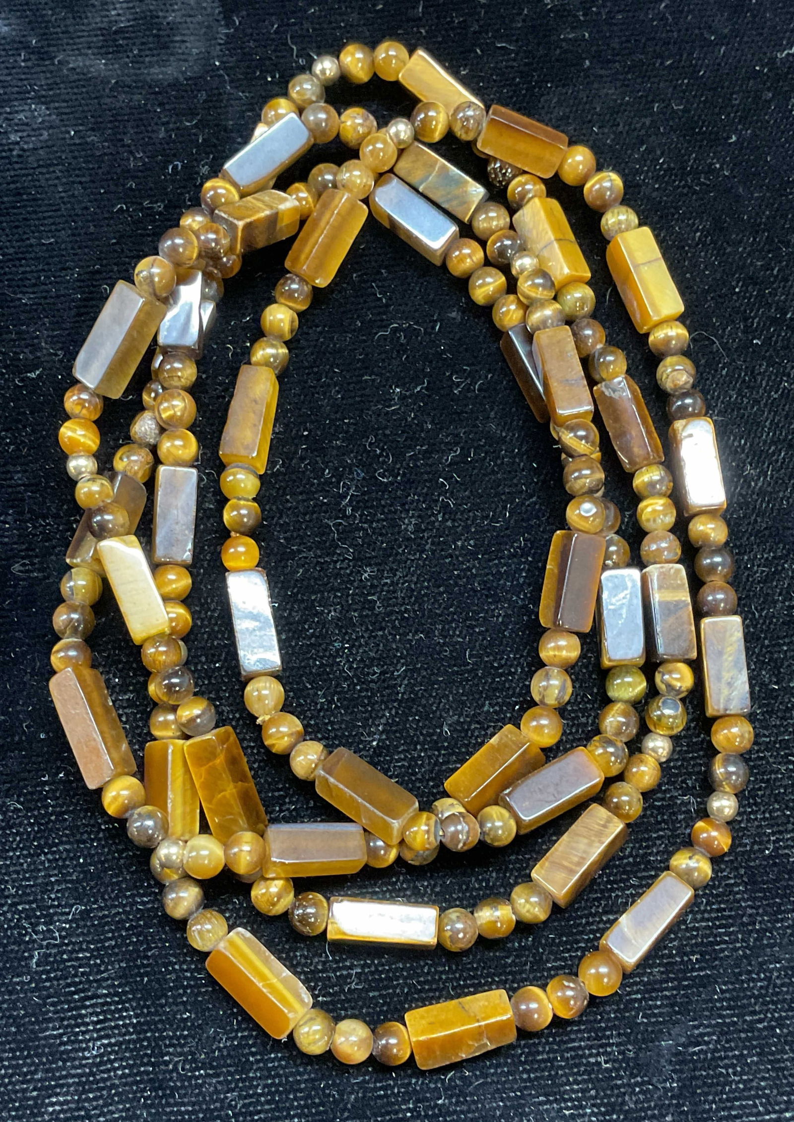 Tigers Eye Semiprecious Beaded Necklace: Tigers eye Semiprecious stone beaded necklace. Drop length approx 16.5 inches. Some scratching. Jewelry, estate jewelry, fine jewelry, cocktail jewelry, fashion jewelry, accessories, fashion accessori