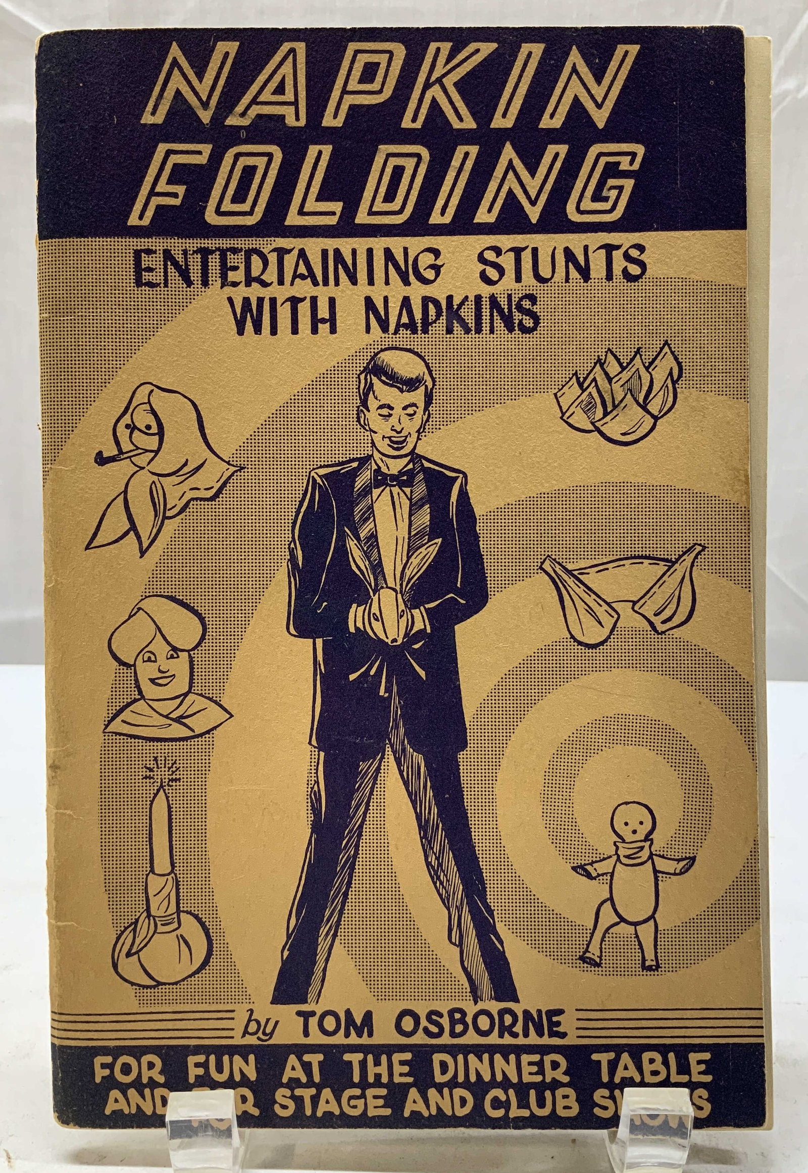 1945 Napkin Folding Entertaining Bk OSBORNE Illustr: 1945 Napkin Folding Entertaining Stunts Bk OSBORNE Napkin Folding: Entertaining Stunts with Napkins by Tom Osborne. COPYRIGHT 1945 by THOMAS JAMES OSBORNE. Published by D. Robbins & Company New York N