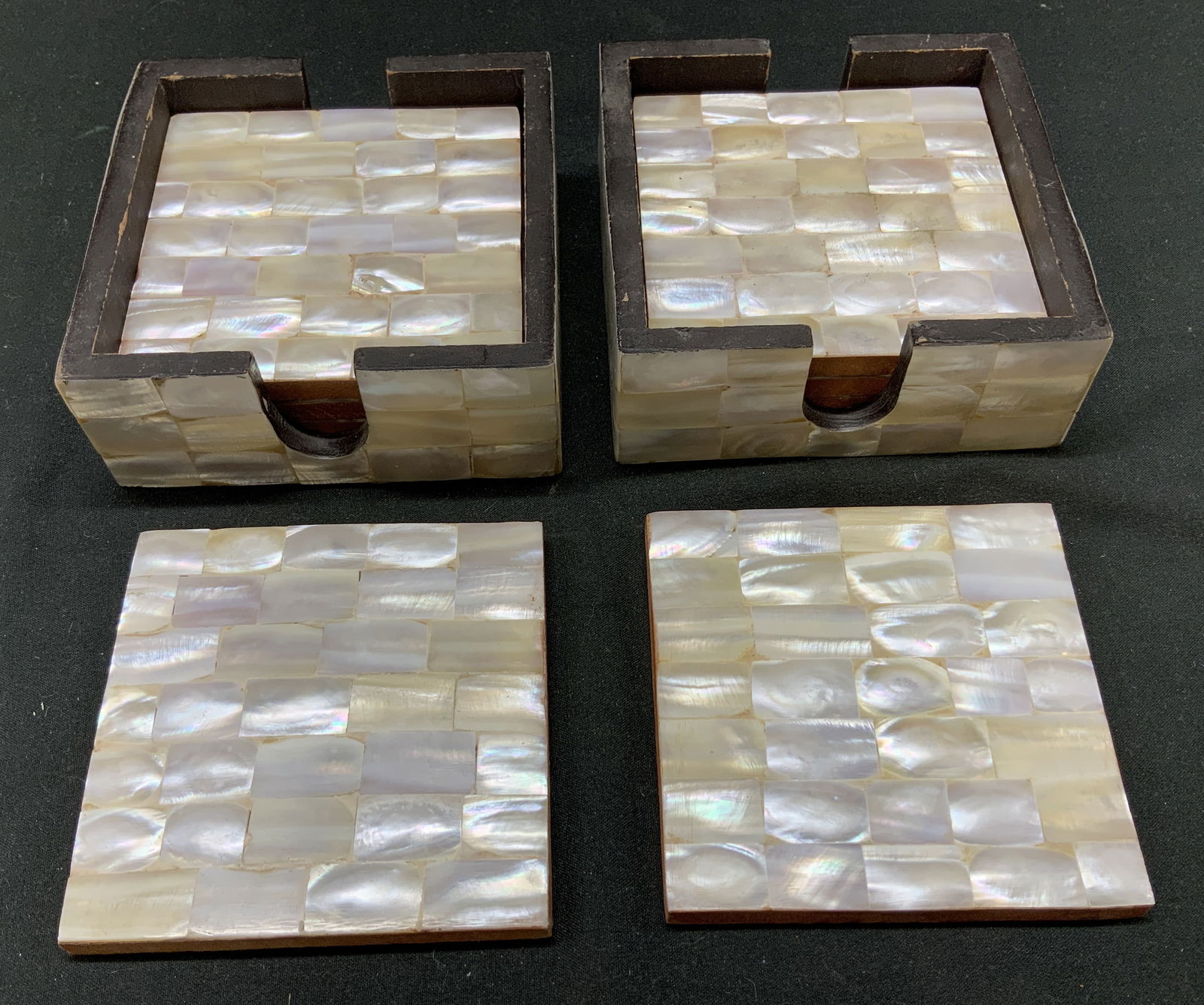 8+ RLK Leilas Mother of Pearl Inlay Coasters INDIA: 8+ RLK Leilas Mother of Pearl Inlay Coasters INDIA Coasters feature set 8 of mother of pearl inlay coasters with a matching holder. They have a distinctive shimmer. Signed & marked on underside. Reads