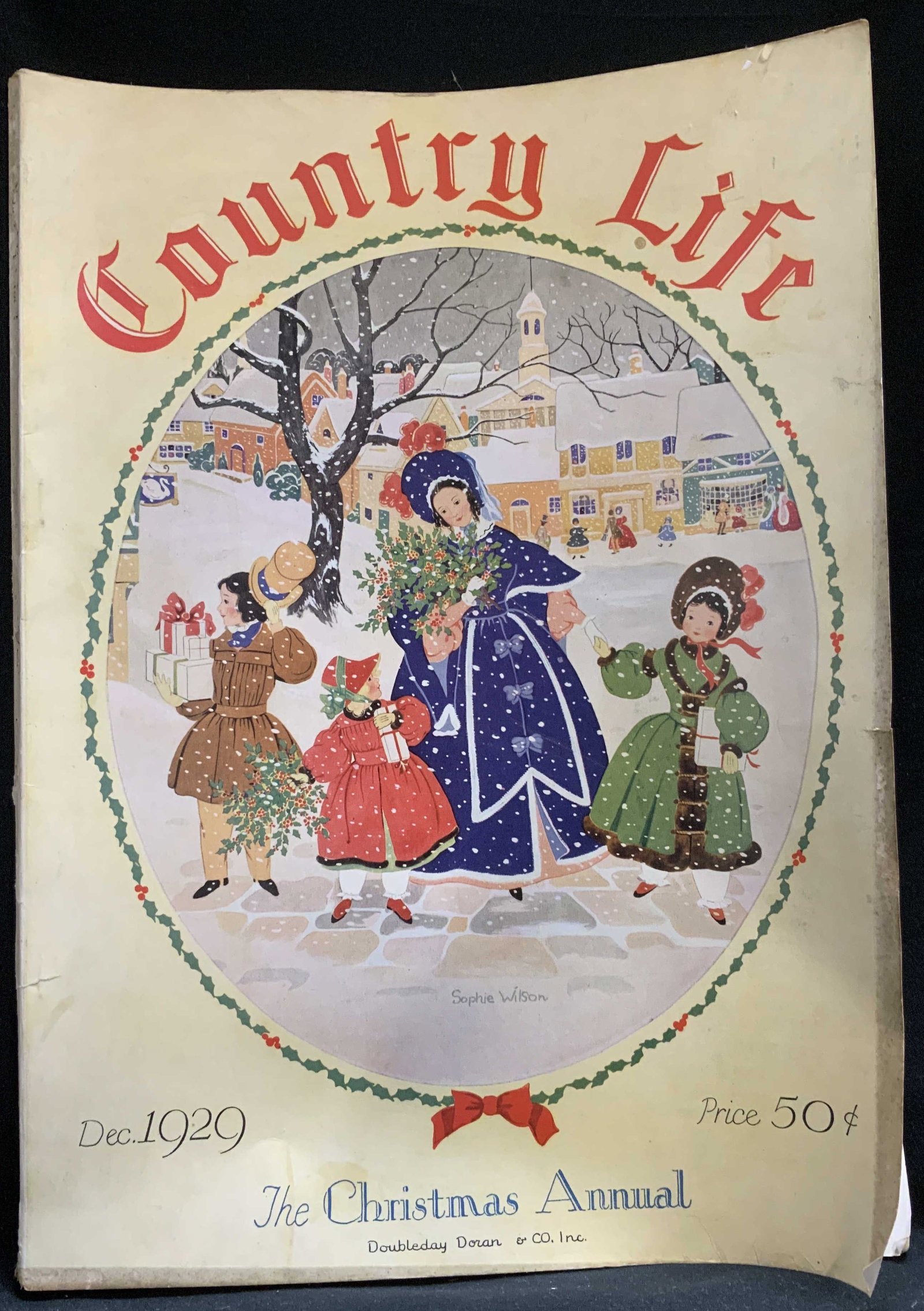 1929 Country Life Vol.LVII NO.2 Christmas Magazine: Vintage magazine titled Country Life, specifically the December 1929 issue. The Christmas Annual. Published by Doubleday Doran & Co. Inc. Vol. LVII & No.2. Front cover features a festive winter scene 