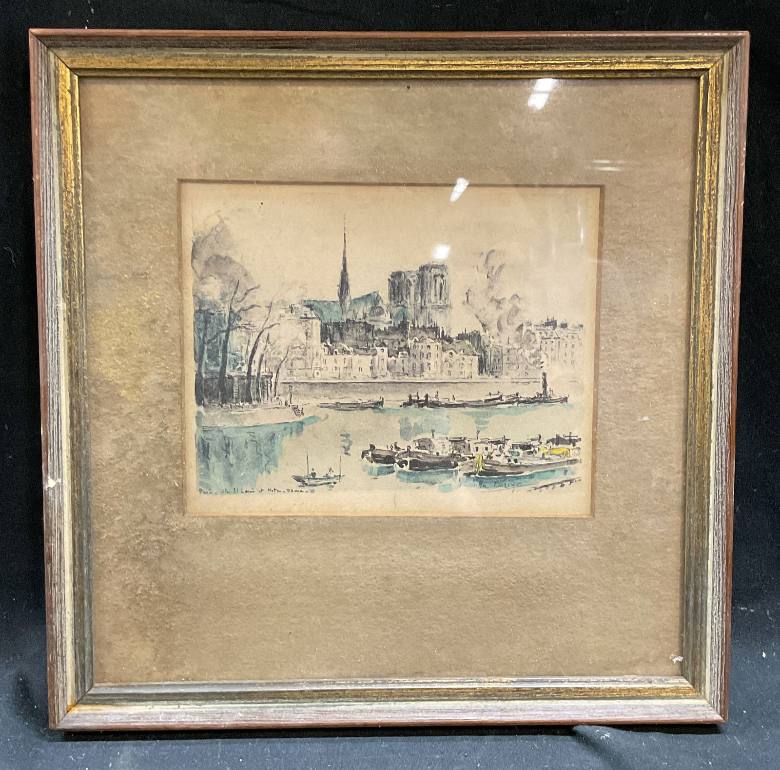 Framed Paris View of Notre Dame Lithograph: Framed and matted lithograph on paper. Paris scene, view of Notre Dame. Signature in print, illegible. Gilt wood frame. Not examined out of frame. Frame measures approx 8.75 x 8.75 inches. Wear includ