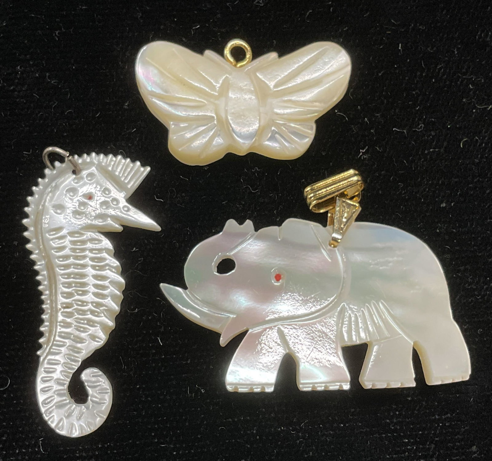 3 MOP Elephant, Butterfly, Seahorse Pendants: Lot of 3 carved mother of pearl pendants. Elephant, butterfly, and seahorse motifs. Largest approx 1 3/8 x 7/8 inches. Some scratching. Jewelry, estate jewelry, costume jewelry, cocktail jewelry, fash