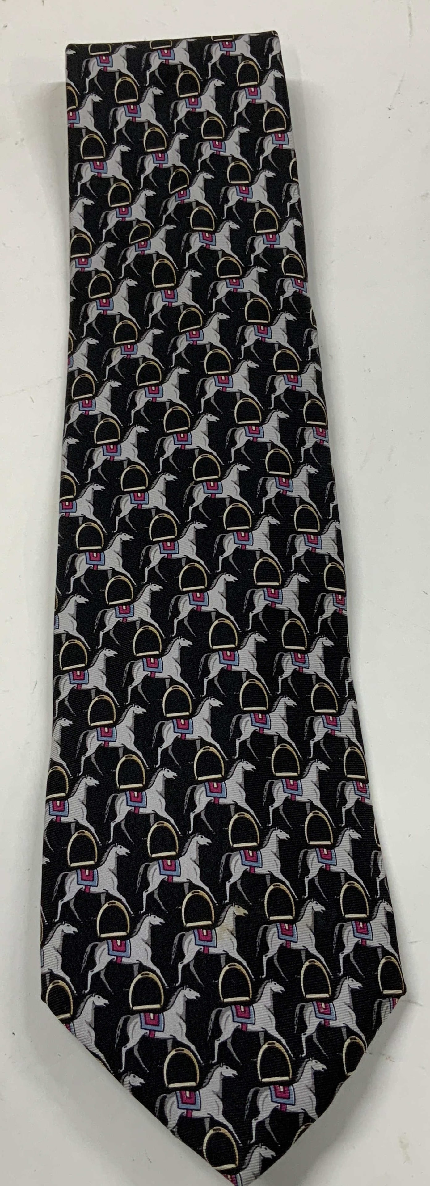 Paolo Designed by Gucci Horse Silk Necktie ITALY: Necktie is silk & features a repeating pattern of horse motifs. Horses are wearing a blue & purple toned saddle. Signed & marked. Reads, PAOLO Designed by PAOLO GUCCI. MADE IN ITALY. SILK. Surface wea