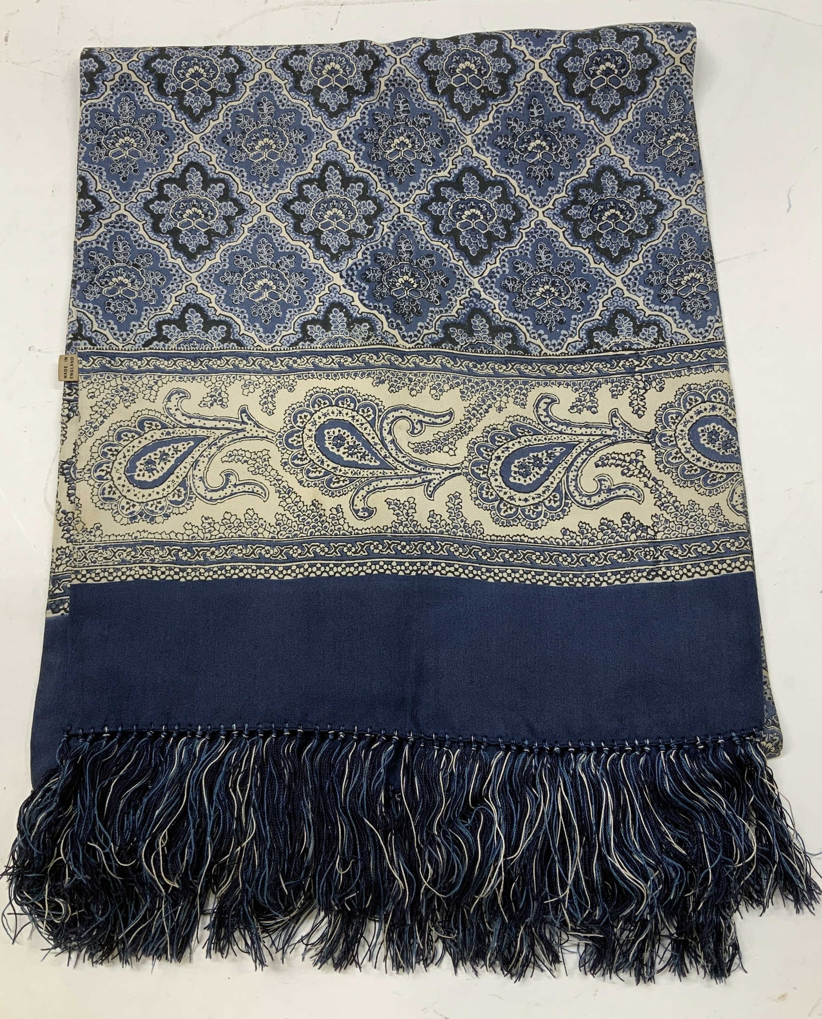 Brooks Brothers Paisley Fringed Scarf ENGLAND: Scarf is blue, black & white toned. Features fringed ends & a paisley pattern. Surface wear consistent to age, use & exposure. Signed & marked. Reads, Made in England. Brooks Brothers. Established 181