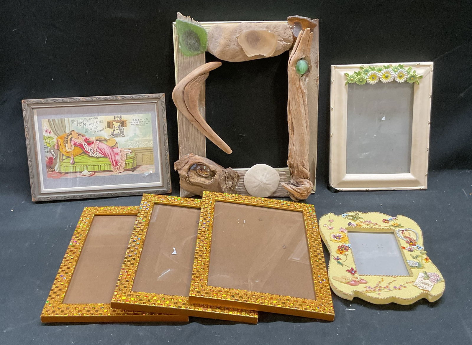 Lot 7 Decorative Picture & Wall Frames: Lot of 7 Decorative picture frames. Easel backing and wall hanging. Driftwood and sea glass frame, resin floral frame, iridescent gold tone frames, white and green floral frame, and silver tone wood f
