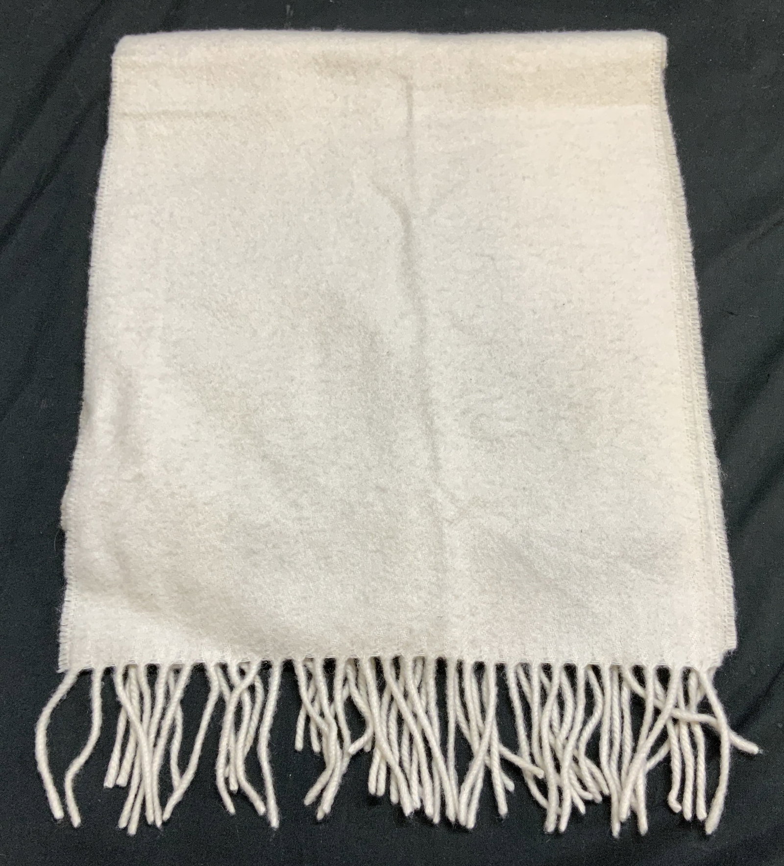 Grant Thomas Cream Fringed Cashmere Scarf GERMANY: Scarf is 100% cashmere & is cream toned w fringed ends. Signed & marked. Reads, GRANT THOMAS 100% CASHMERE. MADE IN GERMANY. Surface wear consistent to age, use & exposure. Measurements: length 49.5in