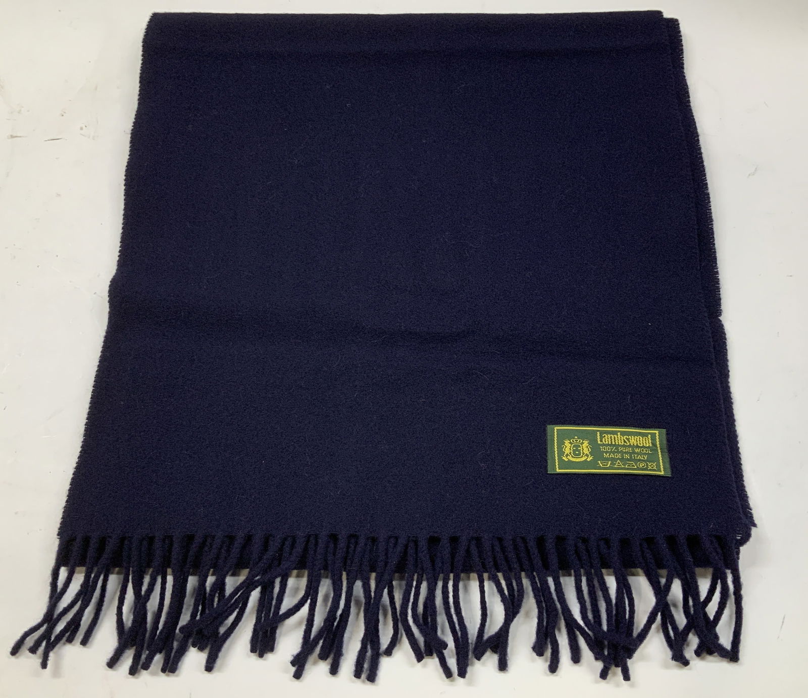 Vntg Navy Lambswool Fringed Scarf ITALY: Scarf is navy toned & features fringed ends. Scarf is 100% pure wool. Signed & marked. Reads, LAMBSWOOL. 100% PURE WOOL. MADE IN ITALY. Surface wear consistent to age, use & exposure. Measurements: le