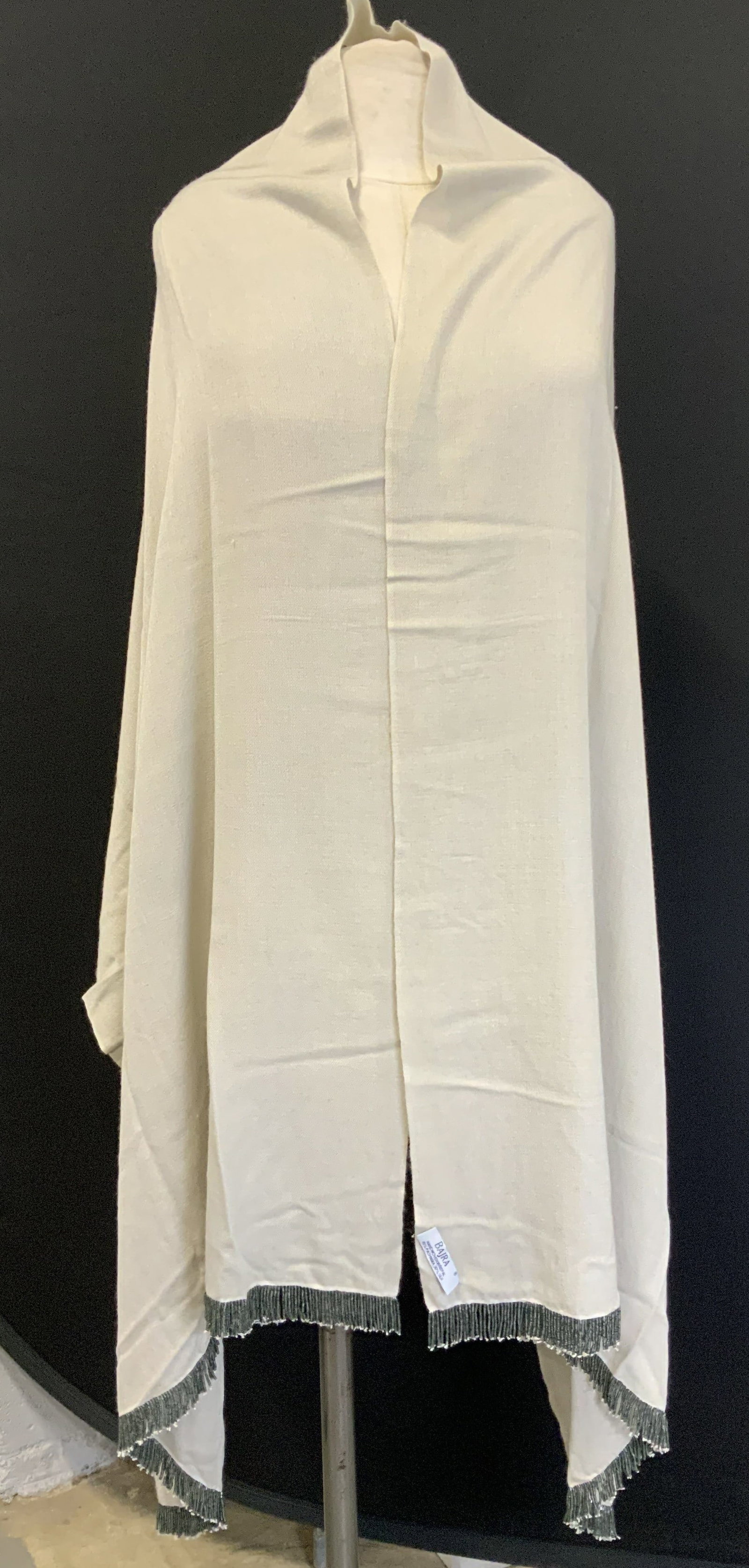 Bajra Hand Woven Shawl W Beaded Fringes NEPAL: Shawl is handwoven & features a light tone w beaded fringe accents. Shawl is 70% pashmina & 30% silk. Signed & marked. Reads, BAJRA. HAND WOVEN IN NEPAL. 70% PASHMINA. 30% SILK. Surface wear consisten
