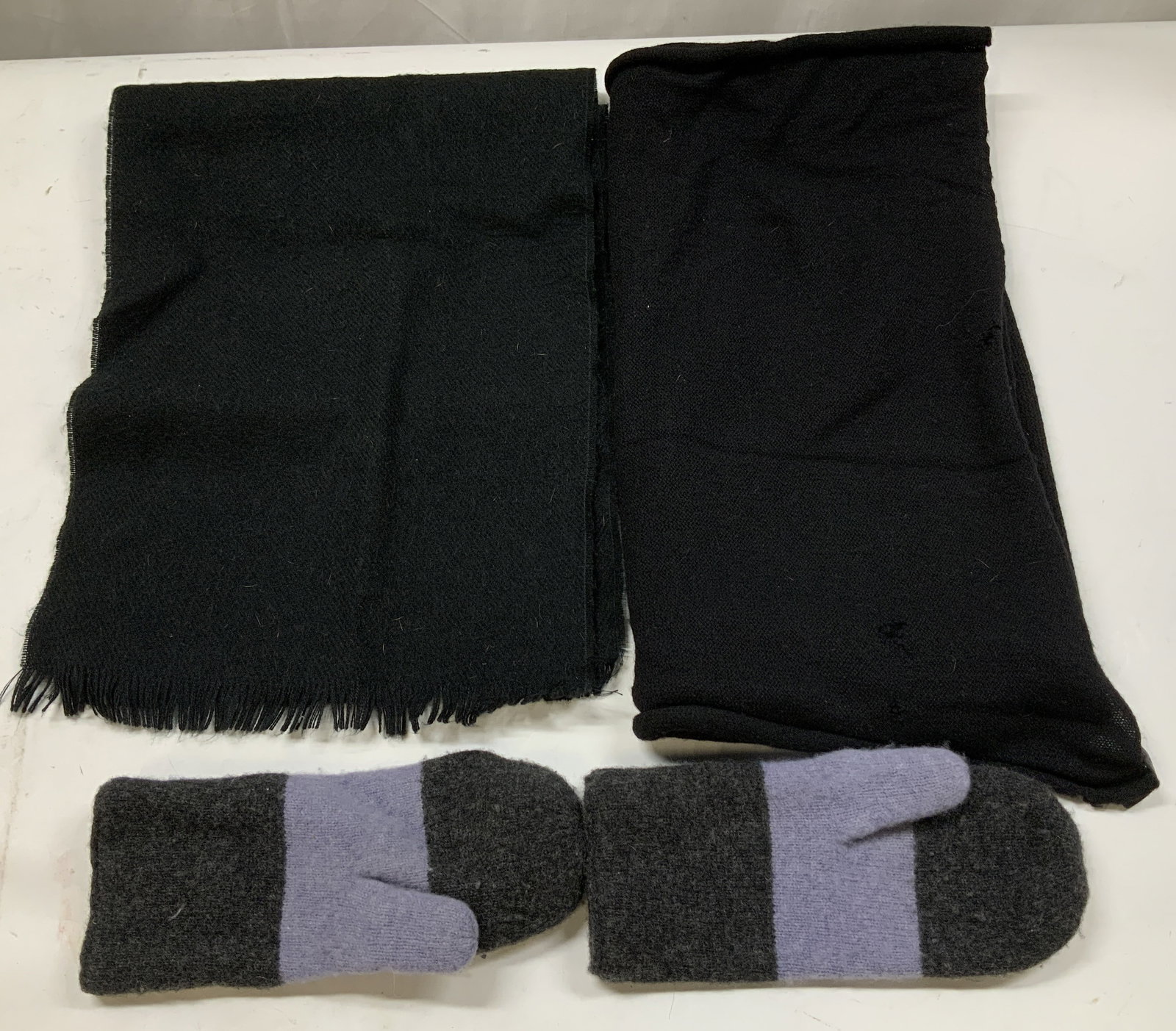 Lot3 Lambswool Striped Mittens & Black Scarves GAP: Lot includes, GAP (M/L) Lambswool mittens, Club Monaco black scarf & synthetic black fringed scarf. Surface wear consistent to age, use & exposure. Measurements: length 50.5in x width 11.7in. Gap lamb