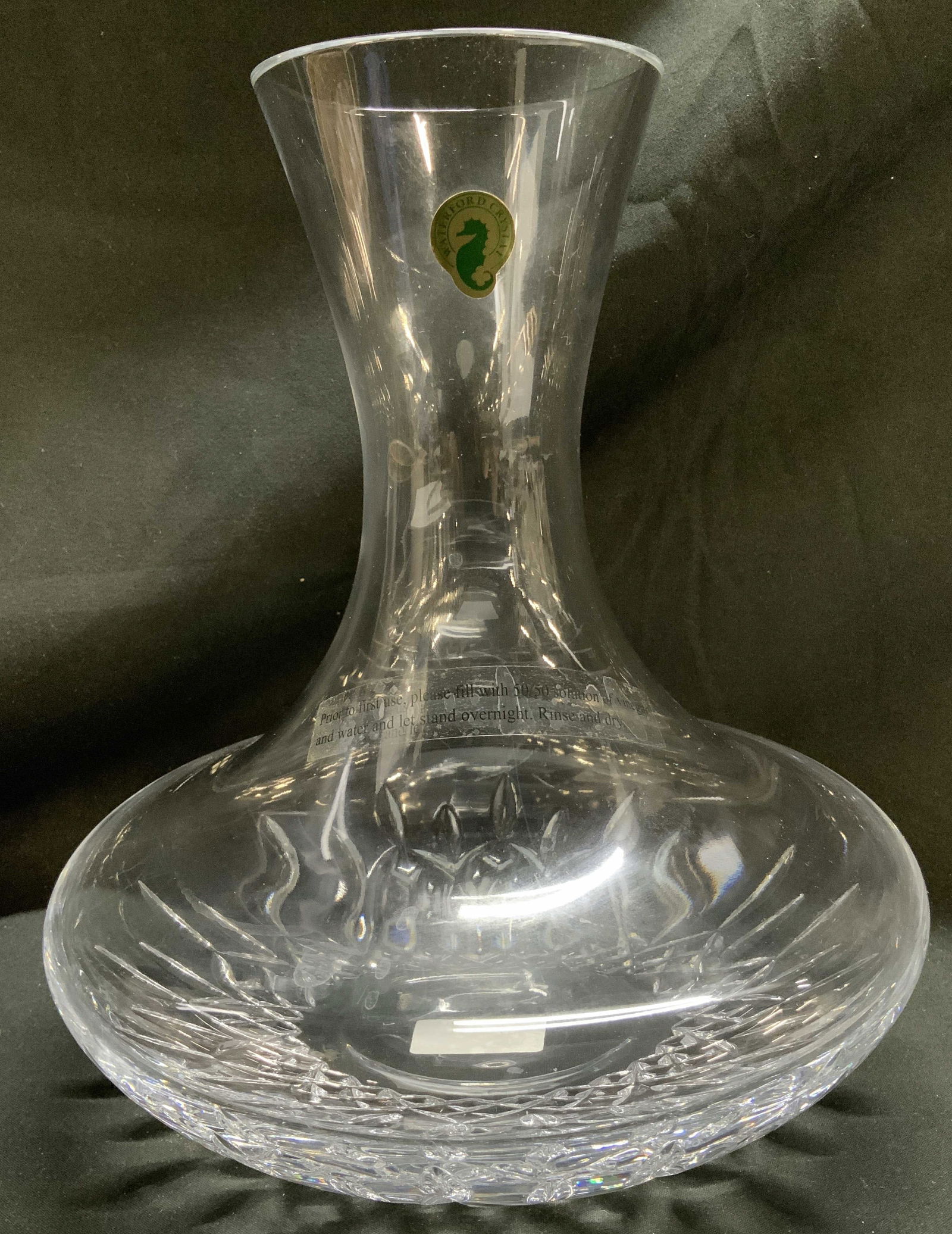 Waterford Crystal Lismore Nouveau Decanting Carafe: Piece is crystal glass & feather a diamond/wedge cuts on base & slender neck. Surface wear consistent to age, use & exposure. Signed & marked on underside. Reads, LISMORE NOUVEAU DECANTING CARAFE. LEA