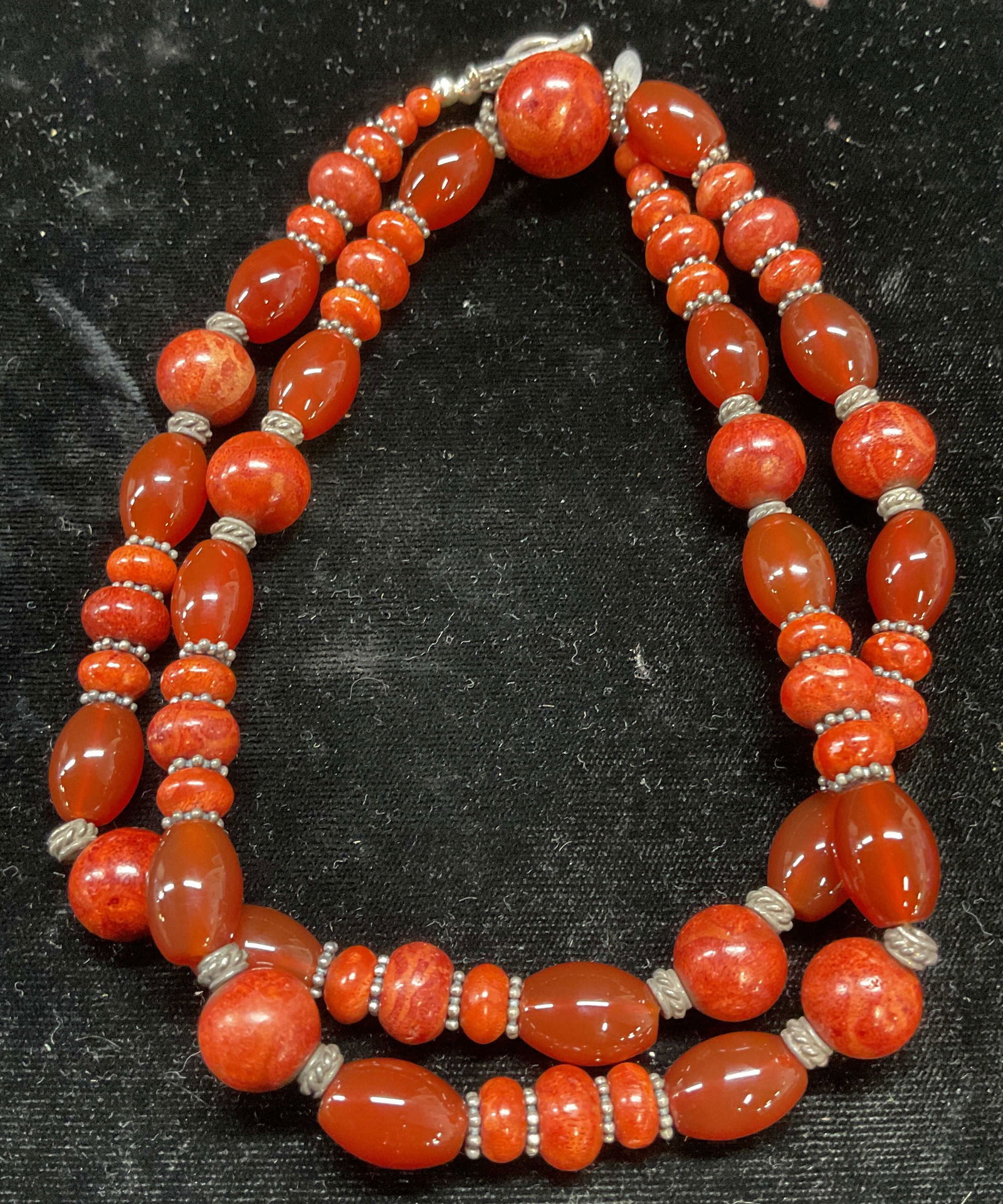 BJ Coral & Carnelian Necklace, Sterling Clasp: Signed BJ coral and carnelian beaded necklace with sterling silver clasp and accents. Marked sterling. Drop length approx 13 inches. Total weight 84.6 grams. Some scratching. Jewelry, estate jewelry,